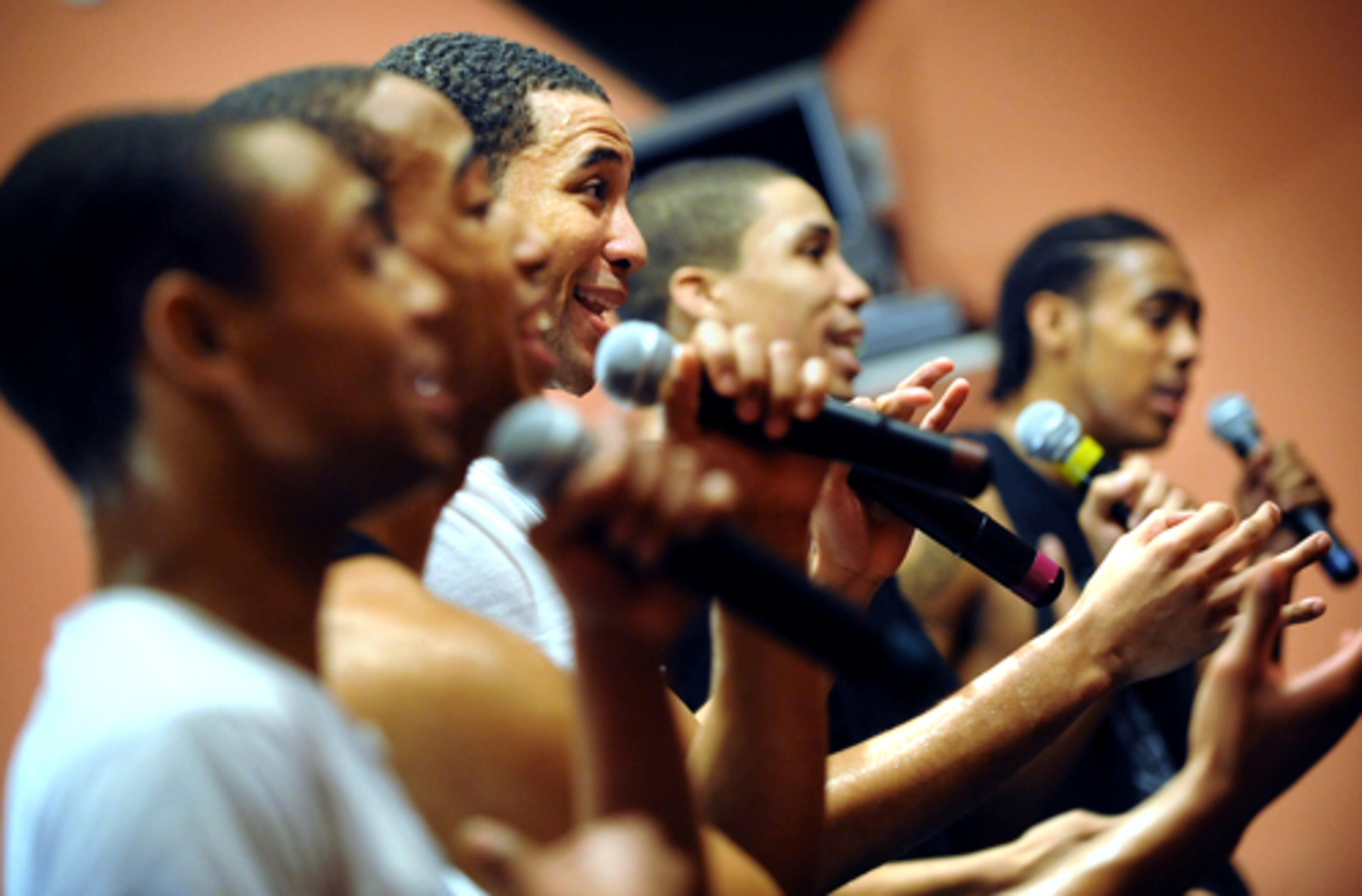 Aspiring R&B act 'Brutha' practices on Wednesday for their upcoming appearance on Atlanta's Peachtree TV. They are a group of brothers who moved here from California to get a record deal. (From left) Anthony Harrell, lead singer, Jacob Harrell, Grady Harrell, Jared Overton, and Pop Harrell perform during their rehearsal at Marvelous Enterprises in Atlanta.