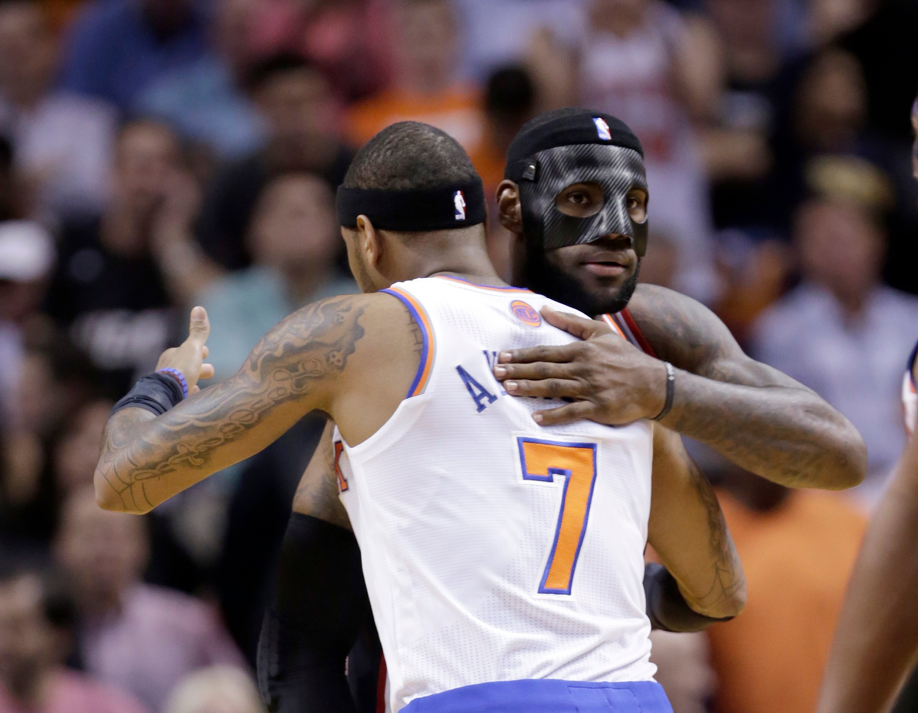 Miami Heat small forward LeBron James, right, and New York Knicks small forward Carmelo Anthony (7) hug before the game Thursday.
