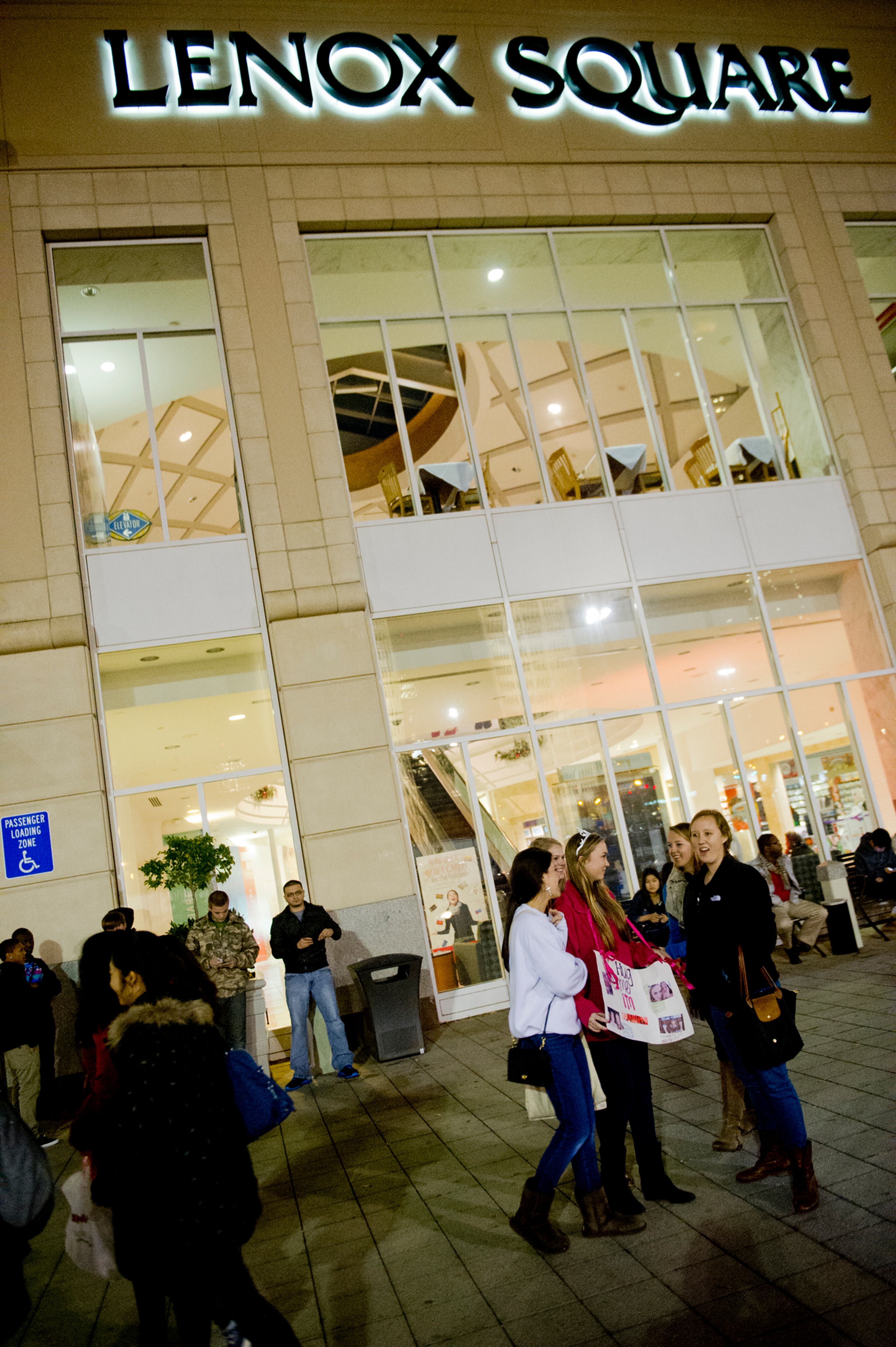 Kendall Smith (right), Halle Muller Klair Adams, and Cecilia John wait for Lenox Square Mall to open as they celebrate Klair's 17th birthday on Thursday, Nov. 22, 2012. The stores inside Lenox as well as stores all over the metro area opened early Friday morning for Black Friday.