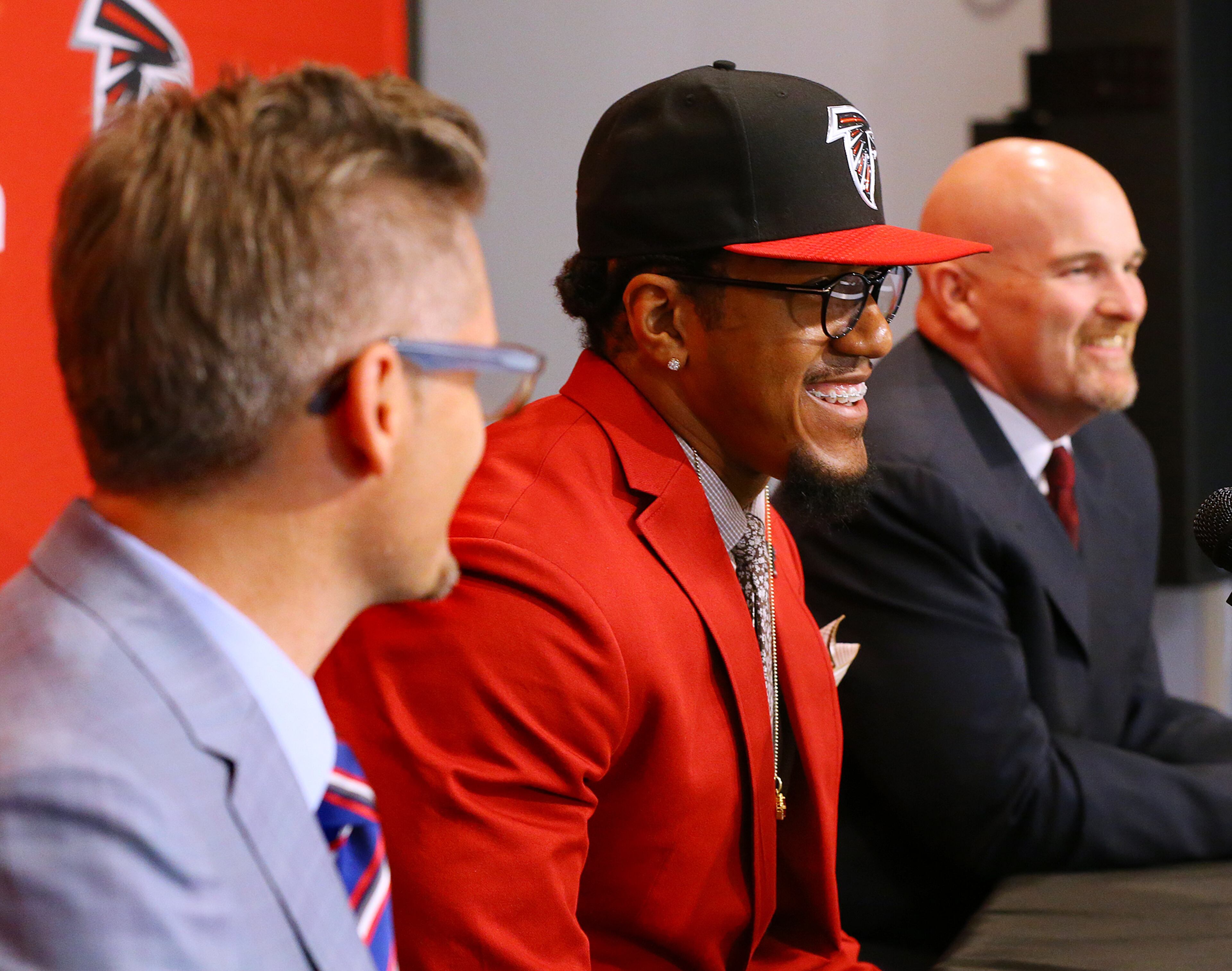 Falcons General Manager Thomas Dimitroff (from left), first-round draft pick Vic Beasley and head coach Dan Quinn share a laugh at the Falcons training facility during a news conference with the team on Friday, May 1, 2015, in Flowery Branch. Beasley, who was the 8th overall pick in the NFL draft, is Clemson's sack leader. Curtis Compton / ccompton@ajc.com