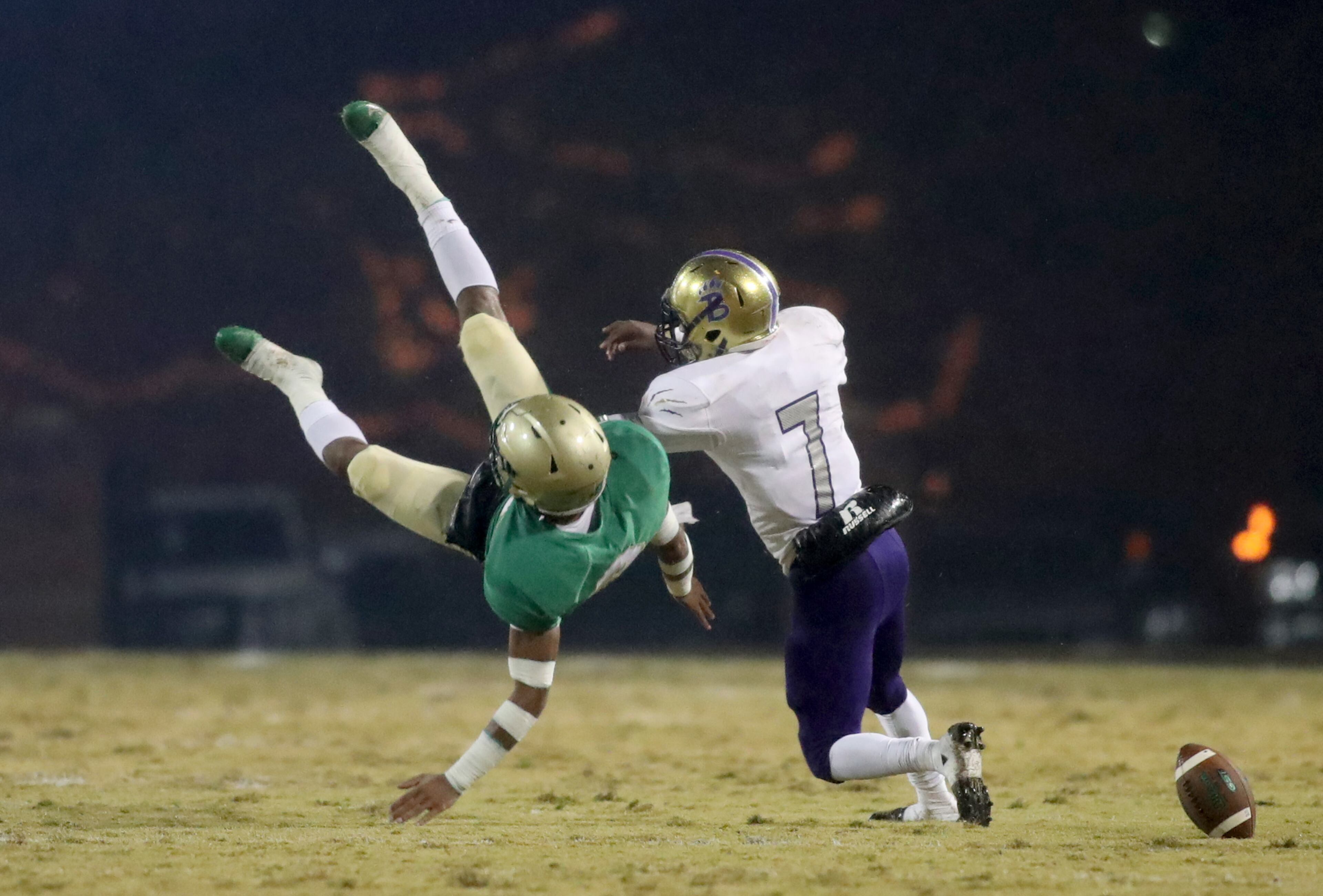 November 23, 2018 - Buford, Ga: Buford wide receiver Xyre Wilson (8) is upended and can't make the catch against Bainbridge defensive back Aaron Spivie (7) in the first half at Buford High School Friday, November 23, 2018, in Buford, Ga. This is the quarter finals of the Class 5A state playoffs. (JASON GETZ/SPECIAL TO THE AJC)