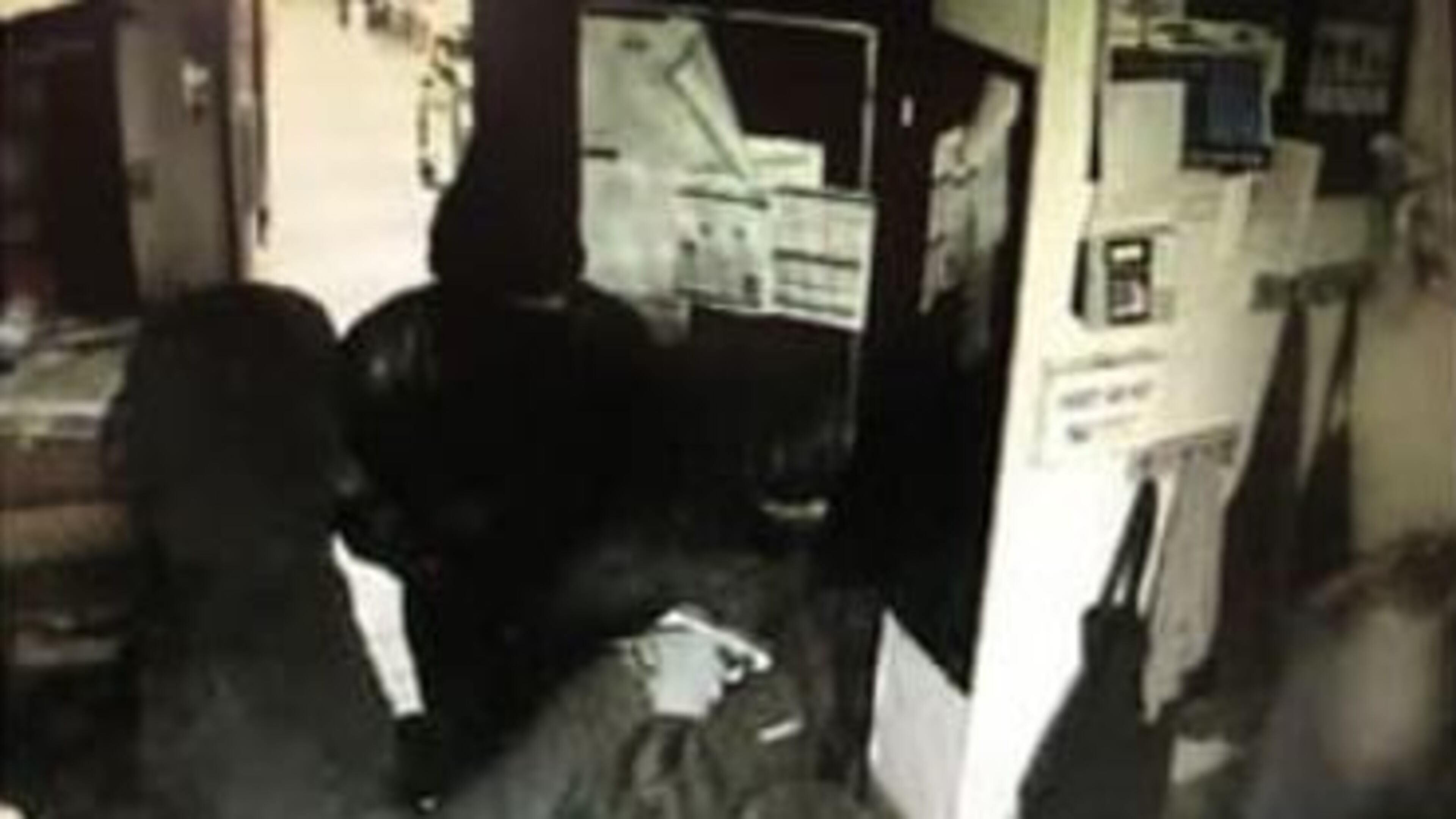 The men and a woman wore dark clothing as they robbed the Waffle House restaurant.