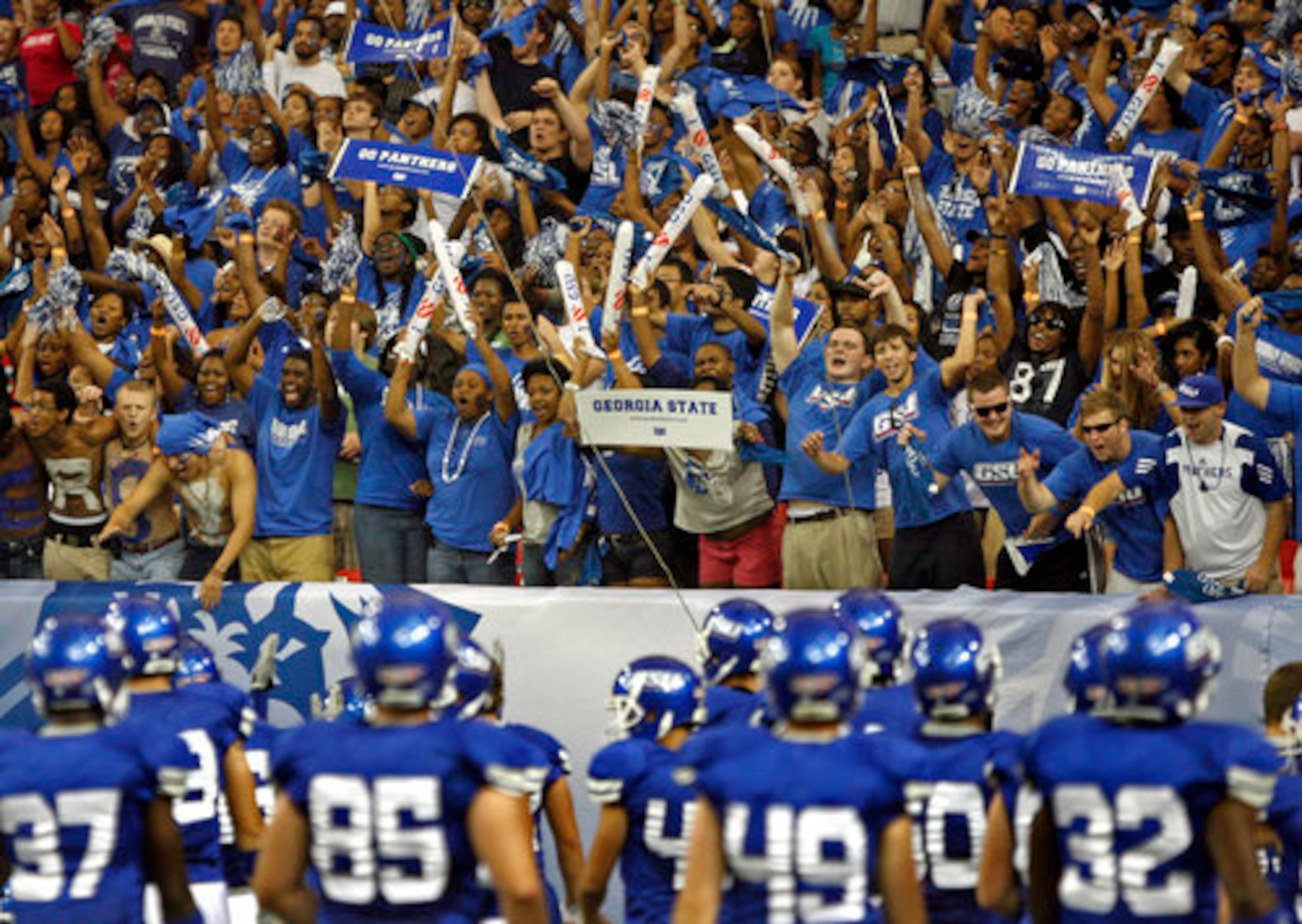 GSU fans cheer on their team as they approach the end zone before going into the locker room for the last time before the start of their inaugural game against Shorter College in the Georgia Dome Thursday night in Atlanta, Ga., Sept. 2, 2010.