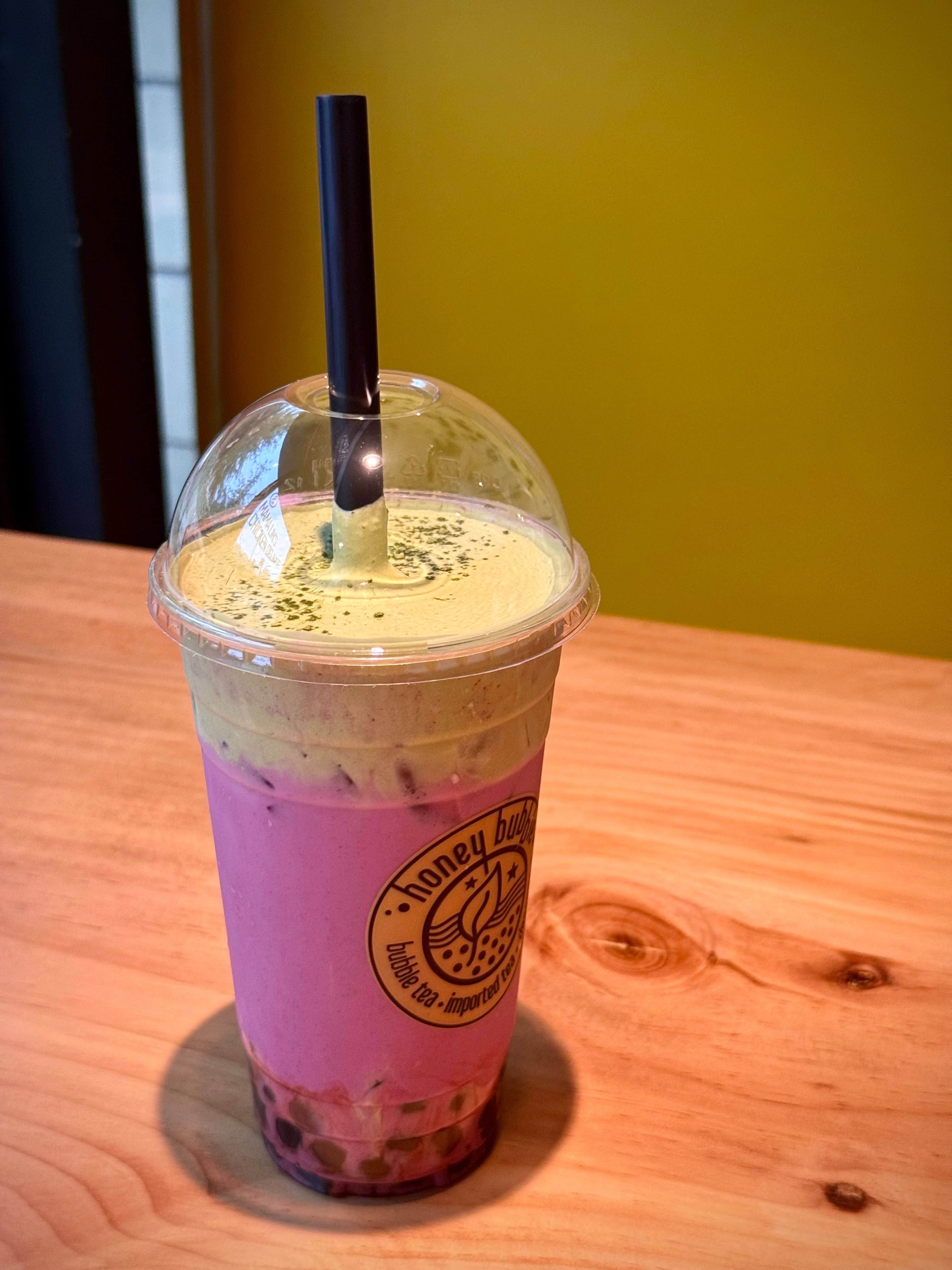 The rich, foamy ube matcha cloud drink from Honey Bubble is surprisingly balanced. (Henri Hollis/AJC)