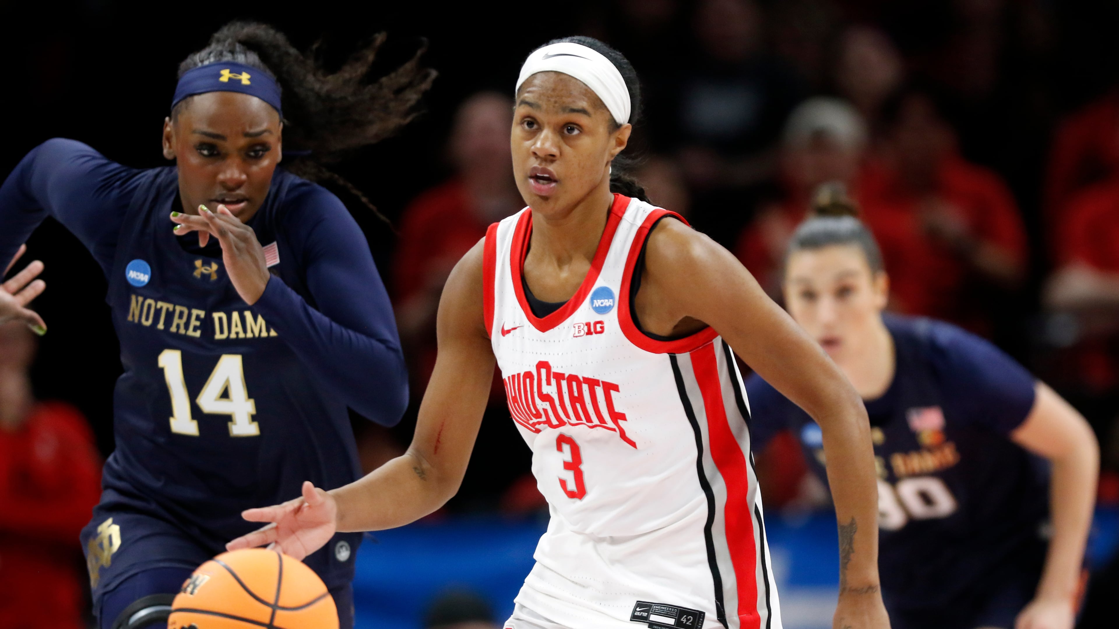 FILE - Ohio State guard Kennedy Cambridge (3) brings the ball downcourt past Notre Dame guard KK Bransford (14) during the first half in the second round of the NCAA college basketball tournament, March 23, 2026, in Columbus, Ohio. (AP Photo/Tom E. Puskar, File)