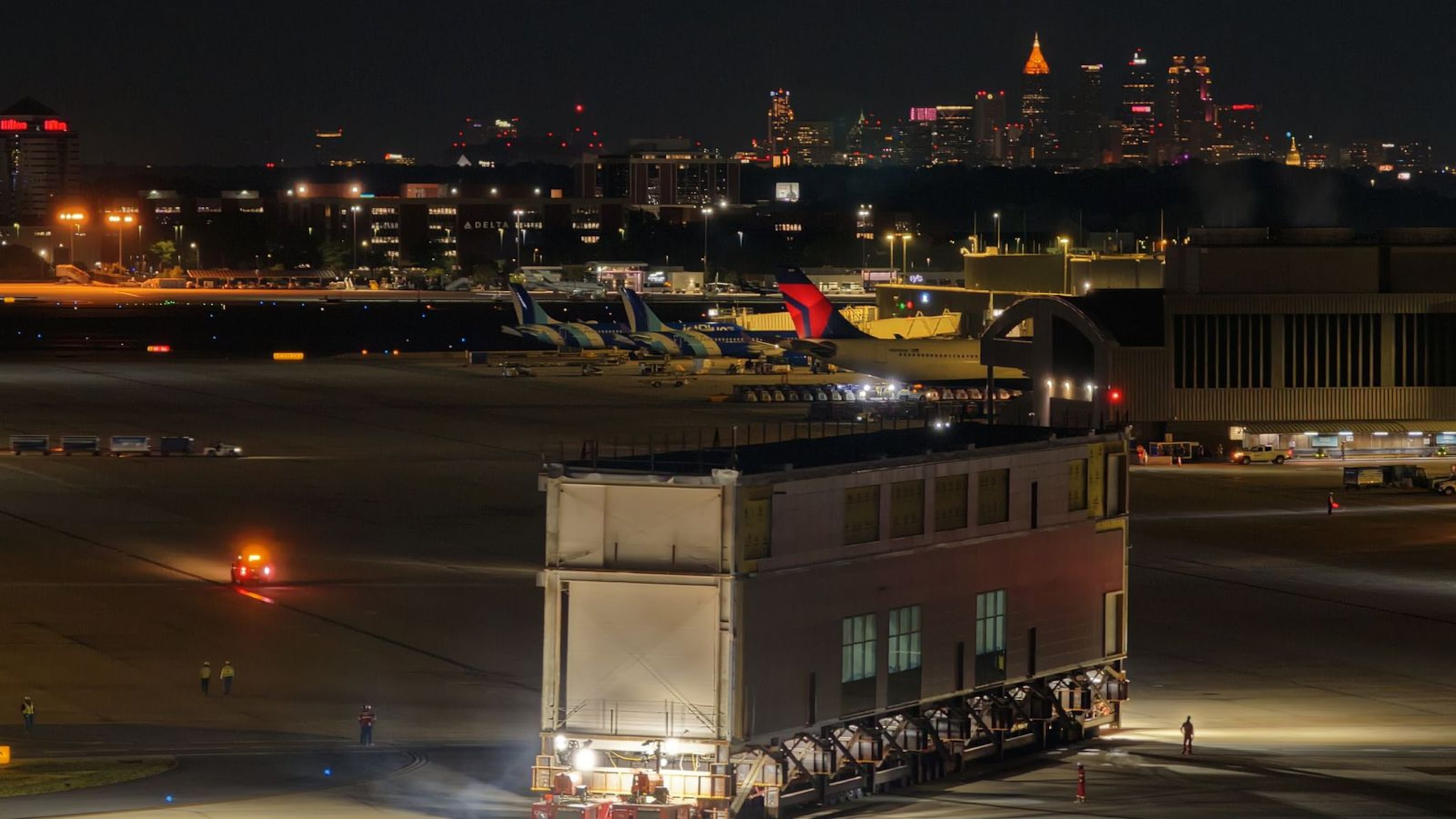 A newly-constructed piece of the airport gets moved across the airfield overnight to put in place on Concourse D. (Courtesy of Hartsfield-Jackson)