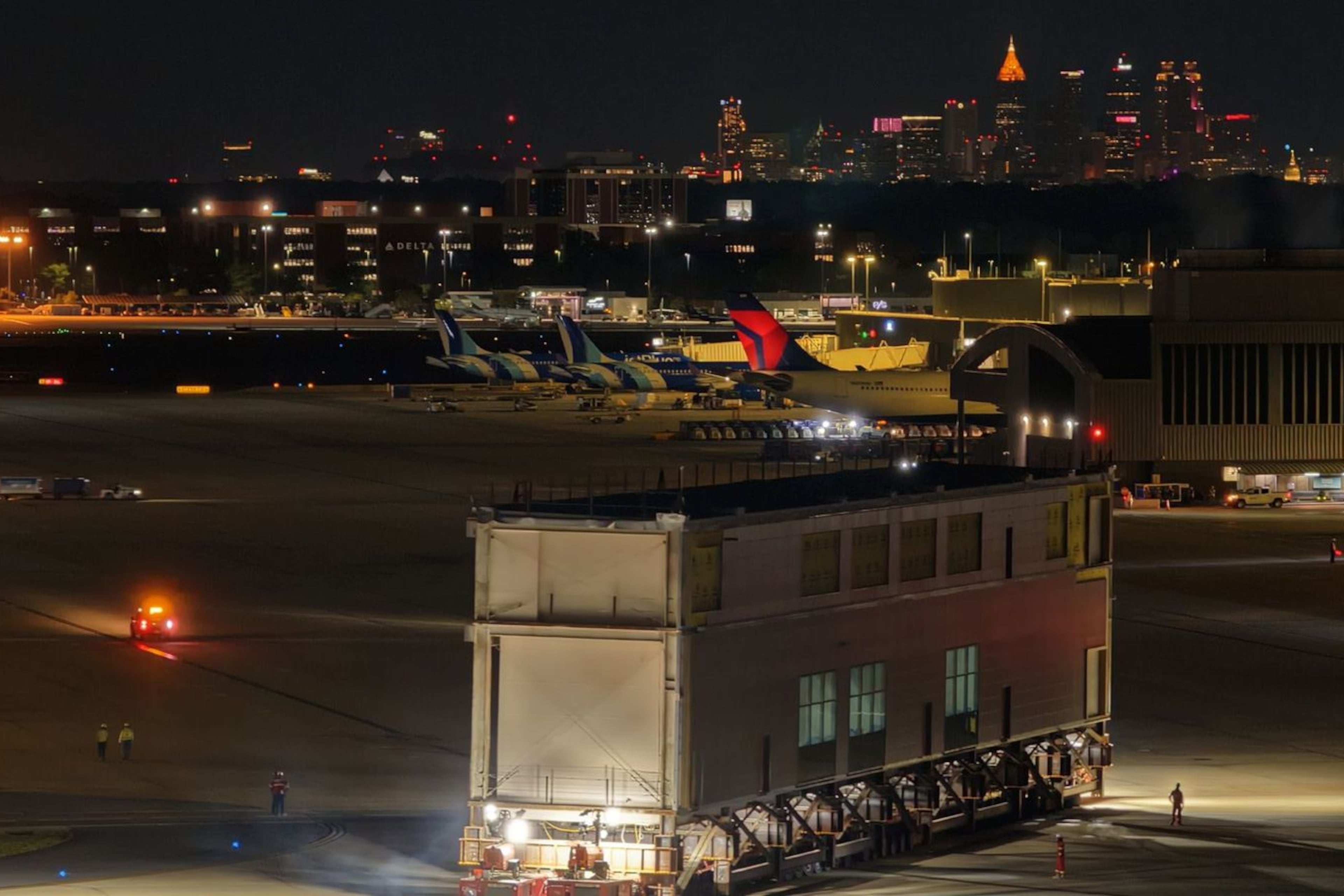 A newly-constructed piece of the airport gets moved across the airfield overnight to put in place on Concourse D. (Courtesy of Hartsfield-Jackson)