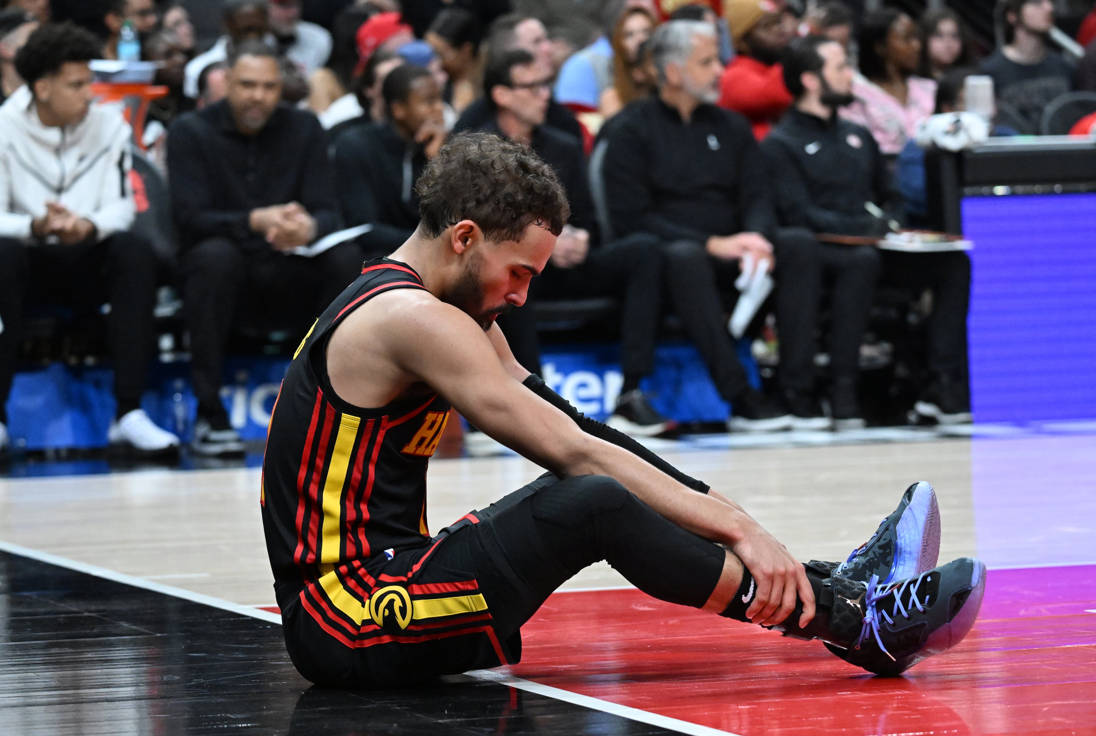 Atlanta Hawks guard Trae Young (11) reacts during the first half in an NBA basketball game at State Farm Arena, Wednesday, March 12, 2025, in Atlanta. (Hyosub Shin / AJC)