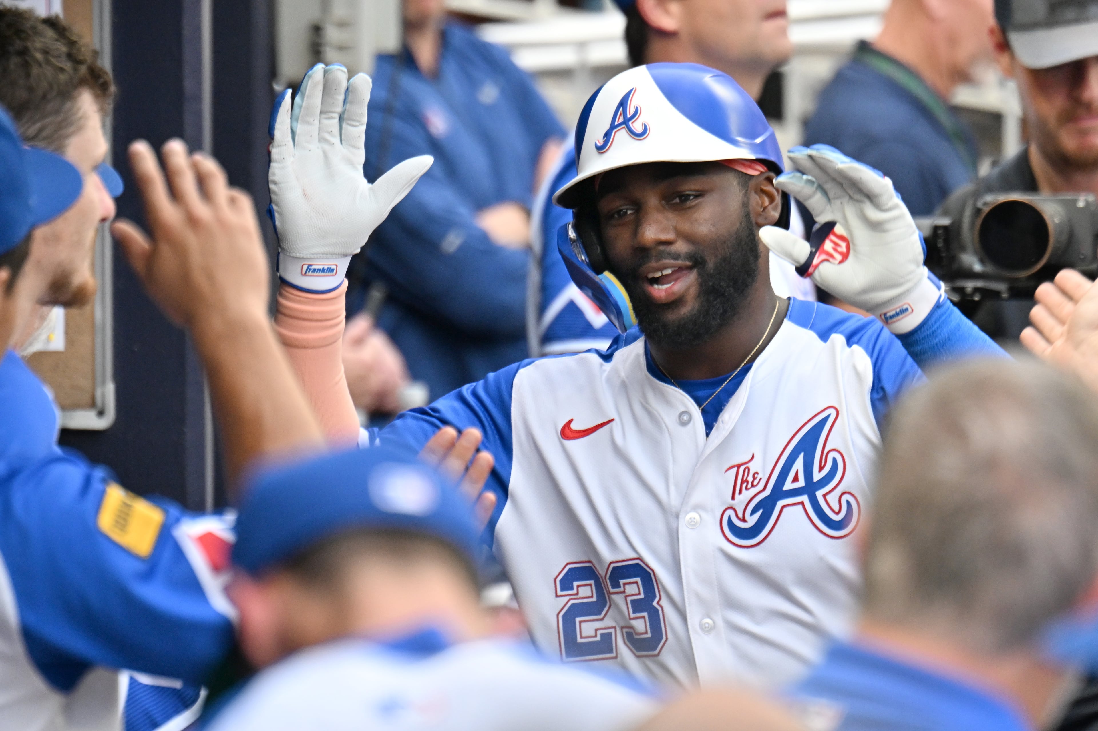 Atlanta Braves outfielder Michael Harris II (23) celebrates with teammates after hitting a solo home run during the third inning of a baseball game at Truist Park, Saturday, July 19, 2025, in Atlanta. New York Yankees won 12-9 over Atlanta Braves. (Hyosub Shin / AJC)