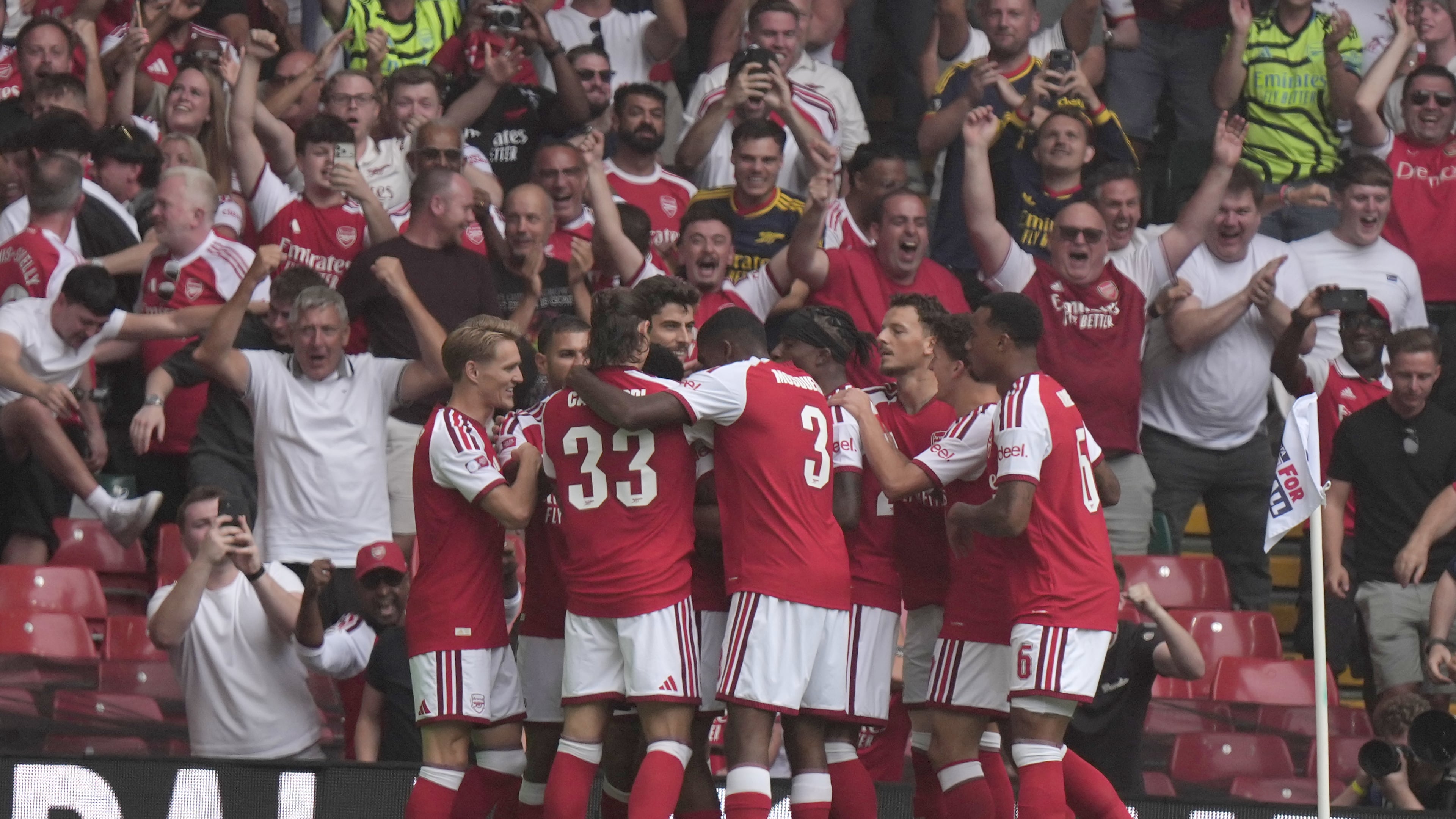 Arsenal's Riccardo Calafiori celebrates with teammates after scoring the opening goal during the FA Community Shield final soccer match between Arsenal and Manchester City in Cardiff, Wales, Sunday, Aug.16, 2026. (AP Photo/Alastair Grant)