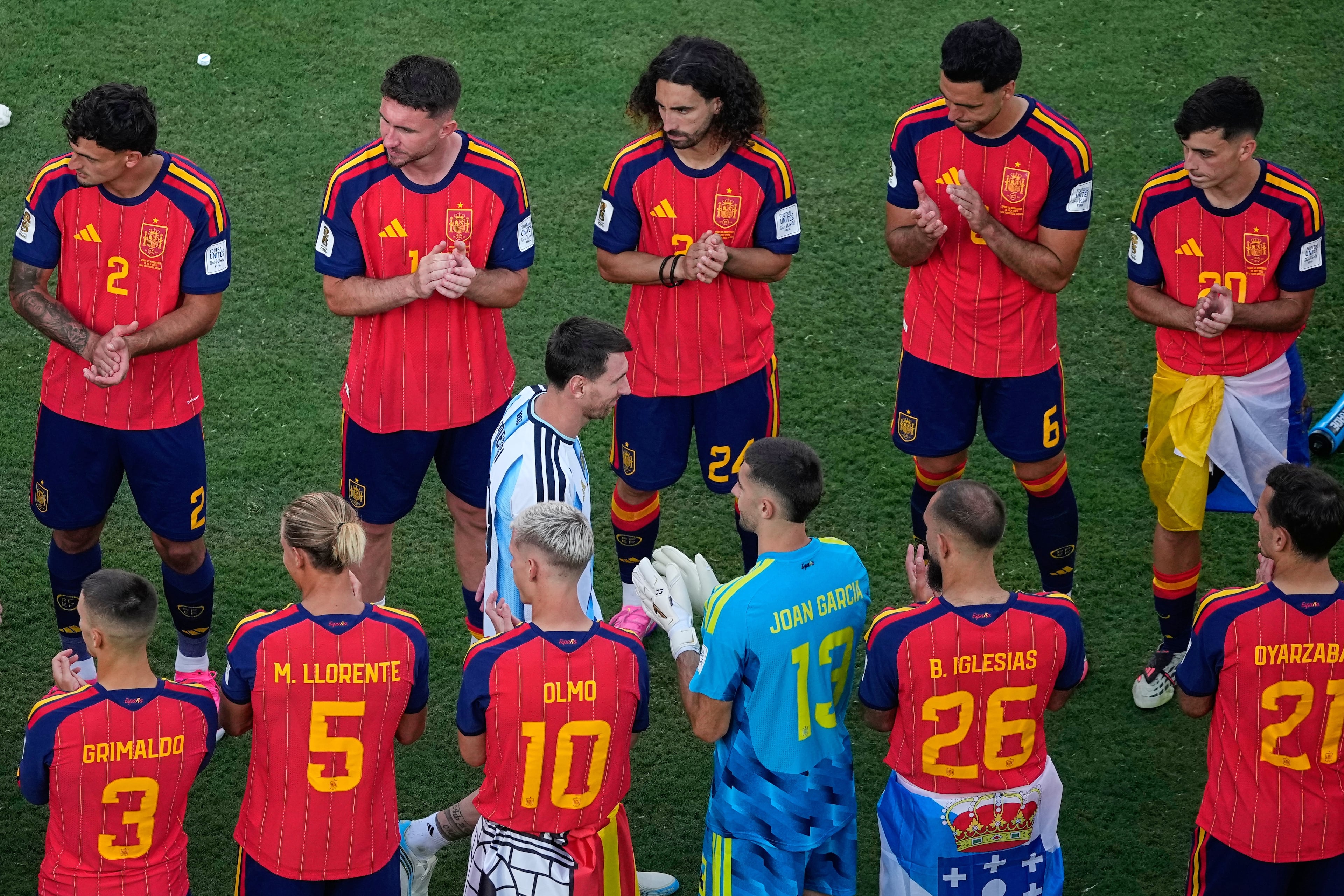 Argentina's Lionel Messi walks between Spain players during the medal ceremony after the World Cup final soccer match between Spain and Argentina in East Rutherford, N.J., near New York, Sunday, July 19, 2026. (Matt Slocum/AP)