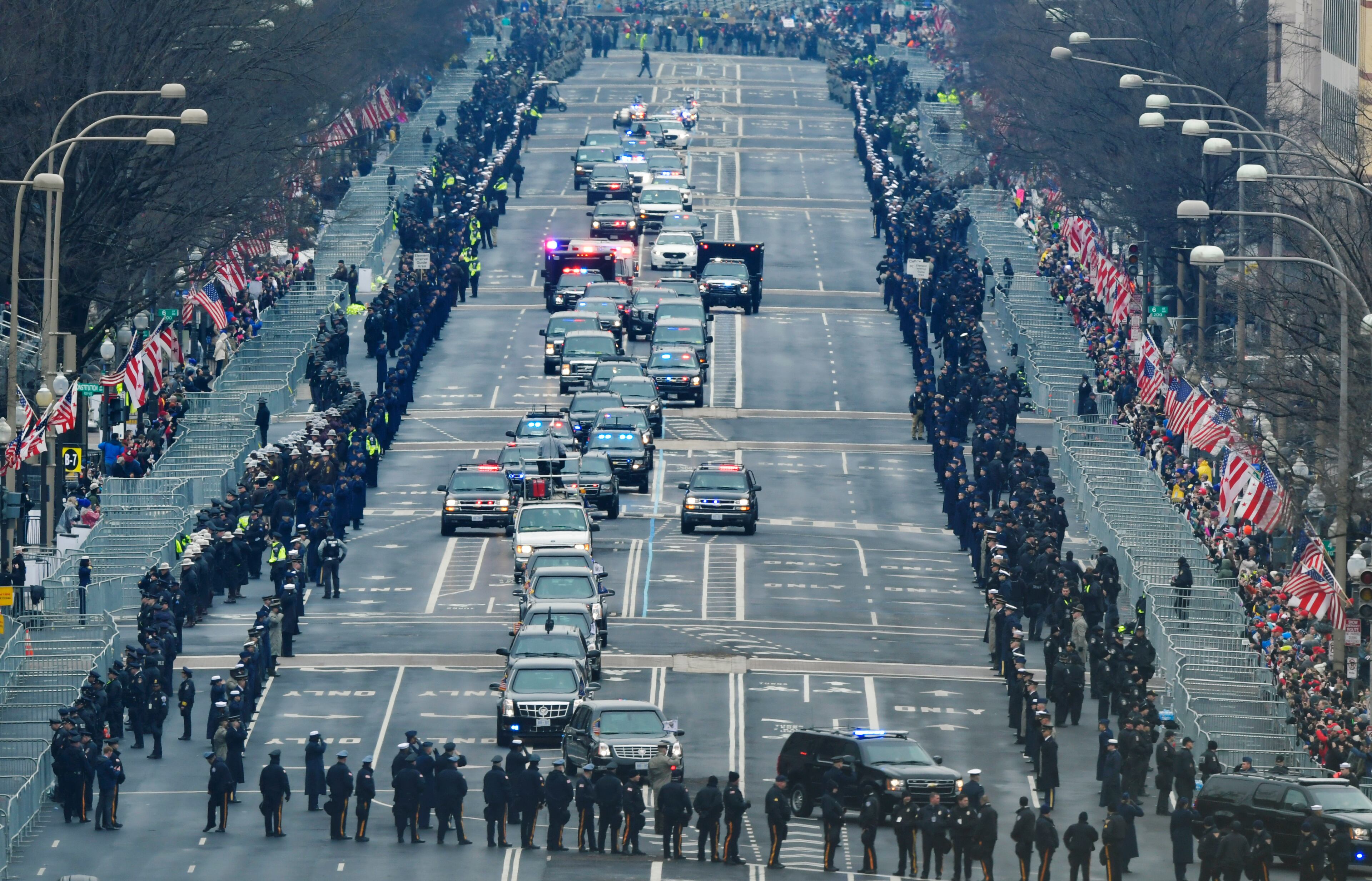 President Barack Obama and President-elect Donald Trump's motorcade drives down Pennsylvania Avenue for the 58th Presidential Inauguration at the U.S. Capitol in Washington, Friday, Jan. 20, 2017. (AP Photo/Susan Walsh)