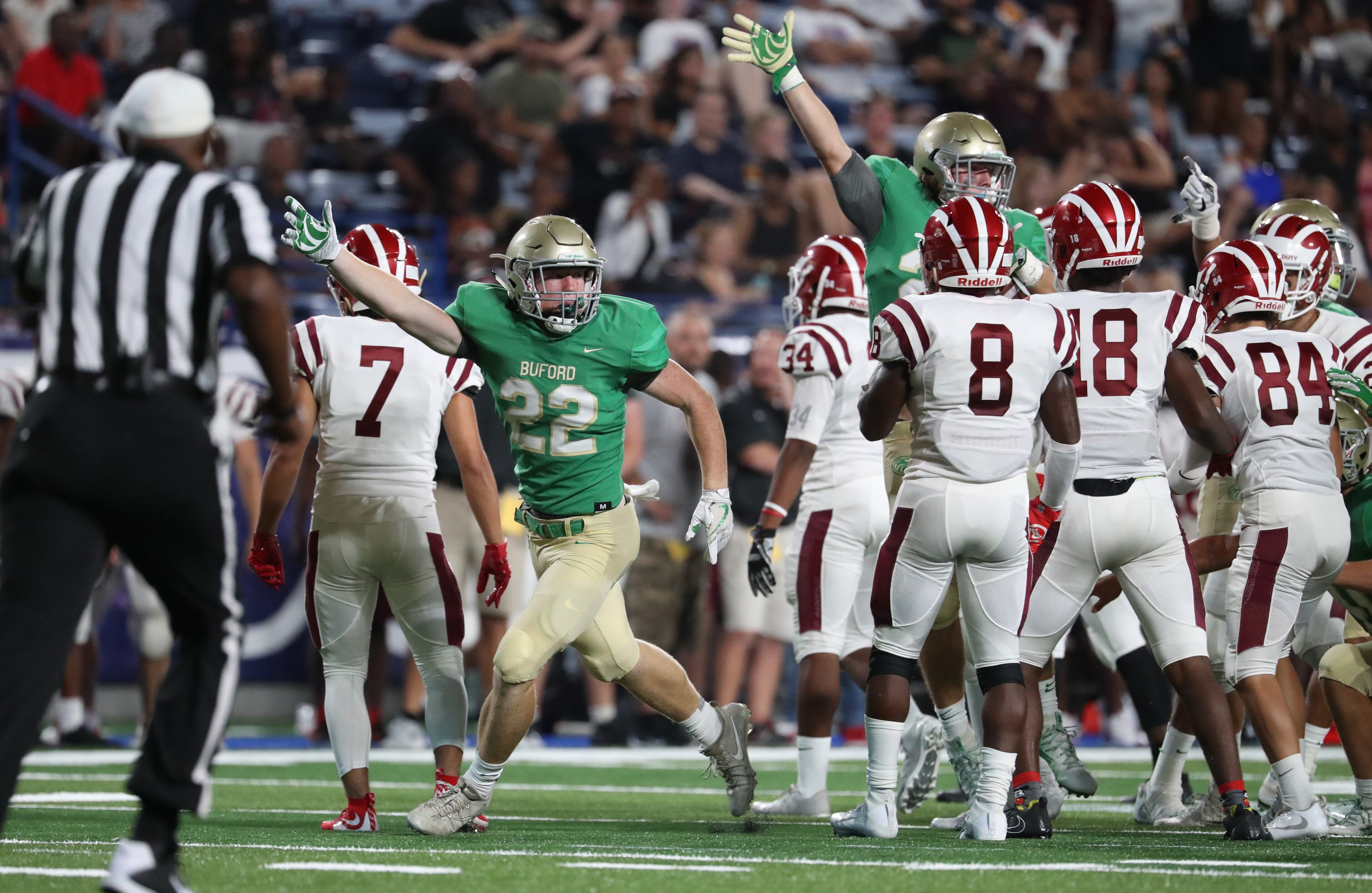 Buford linebacker Grant Breyo (22) celebrates a Buford fumble recovery against Hillgrove in the first half of their game during the Corky Kell Classic at Georgia State Stadium Friday, August 18, 2017, in Atlanta.