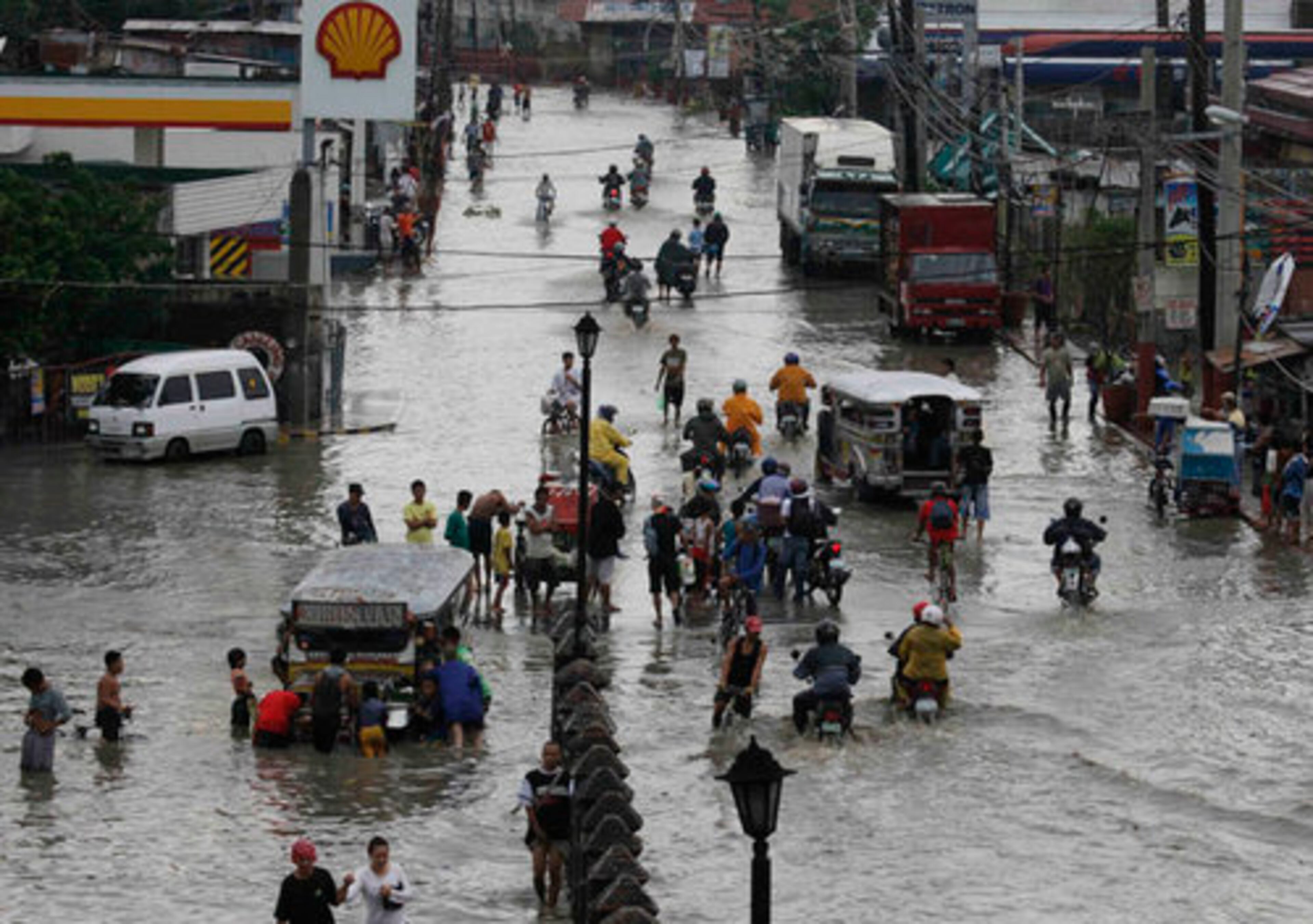 July 14, Mainla, Philippines - Typhoon Conson lashed through several provinces in the Philippines toppling trees and power lines, causing widespread blackouts, canceling flights, classes and suspending work in some government offices.
