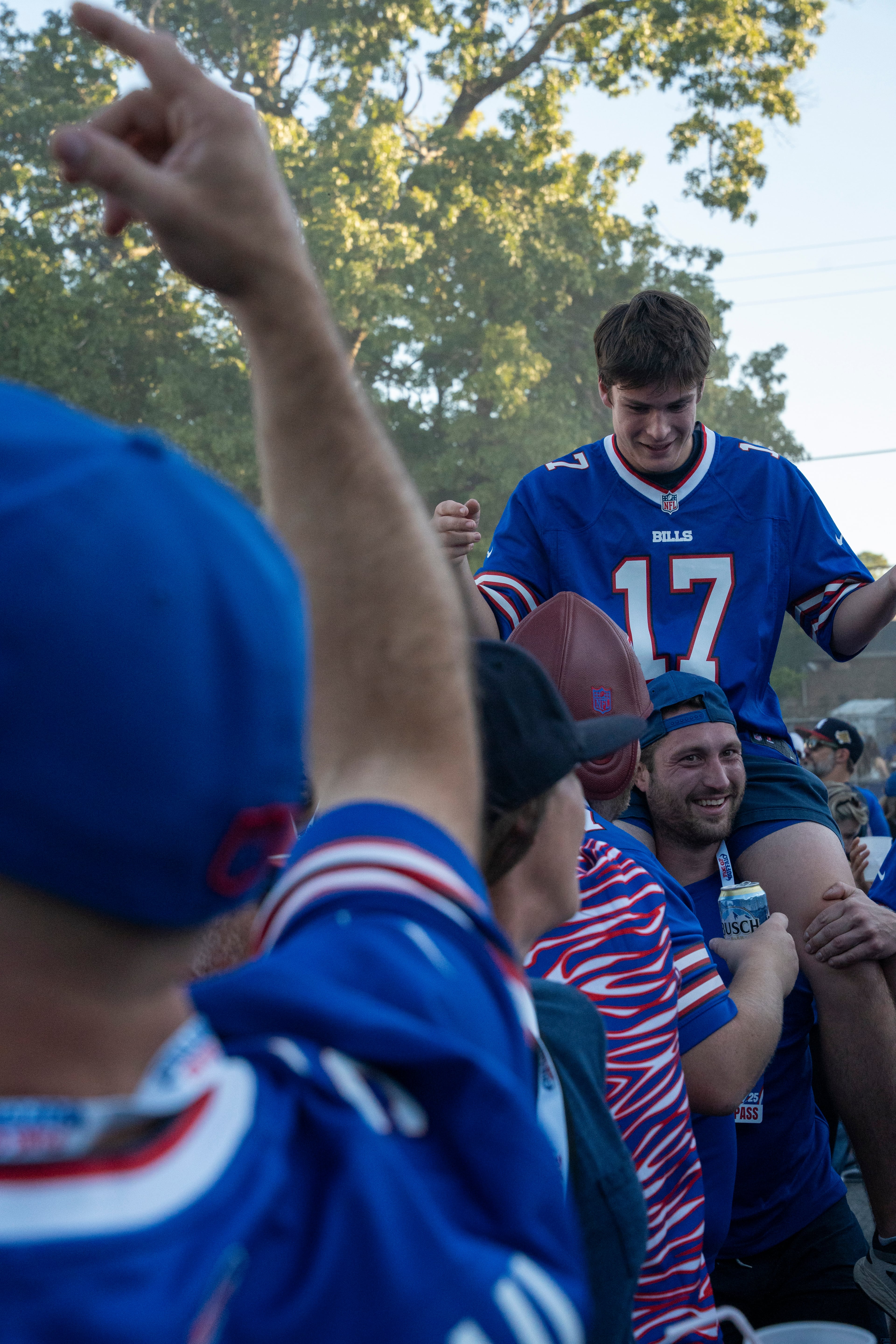 Buffalo Bills fans dance and celebrate at a tailgate near Mercedes-Benz Stadium on Monday, Oct. 13, 2025, in Atlanta, before the Monday Night Football game between the Bills and the Falcons. (Olivia Bowdoin for the AJC)