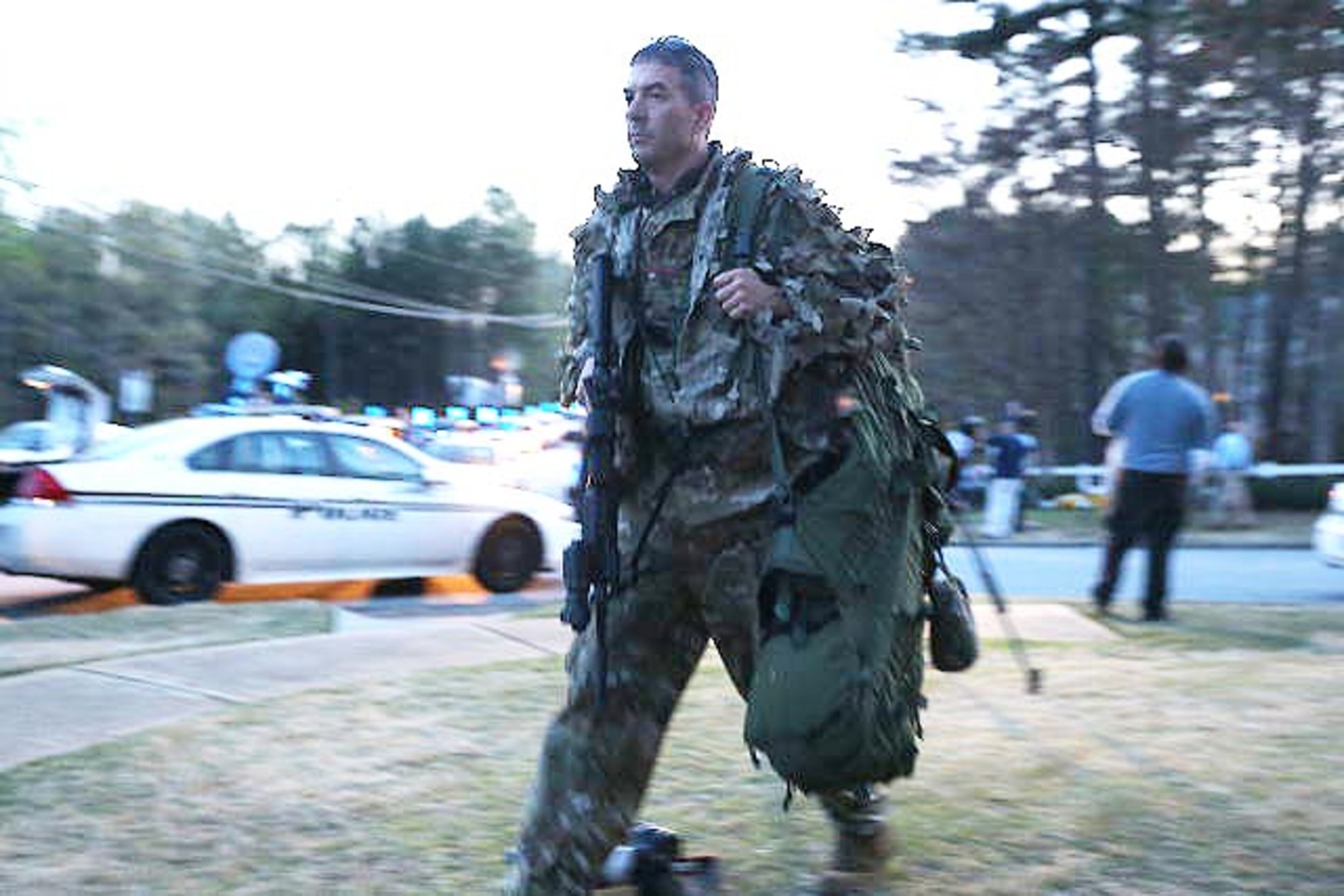 SWAT officers used “flash-bang” -- concussion grenades -- to catch the gunman off-guard as they entered the Suwanee home. They exchanged gunfire with the hostage-taker, who was shot and killed. (BEN GRAY / BGRAY@AJC.COM)