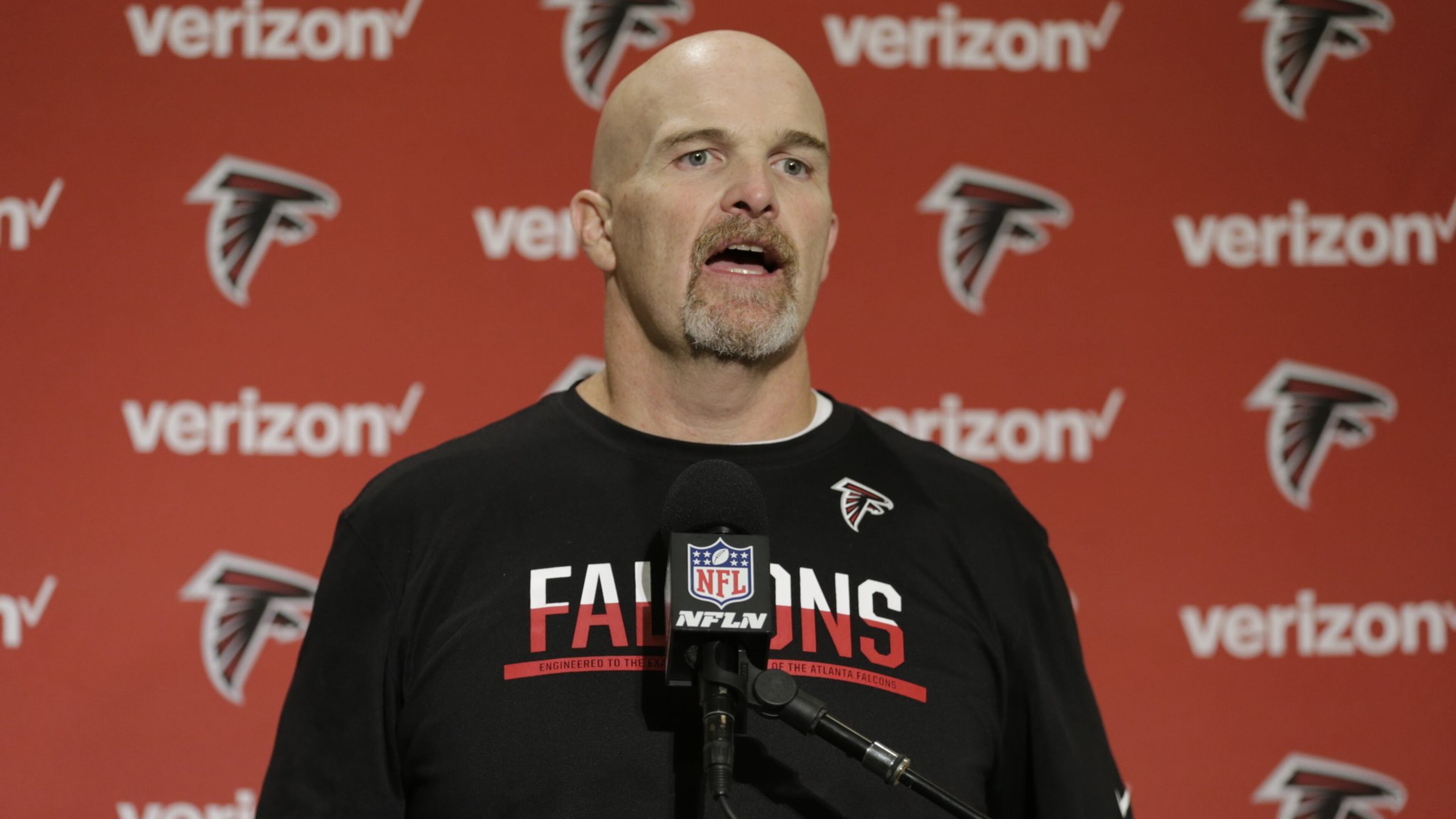 Atlanta Falcons head coach Dan Quinn talks to reporters in a post-game press conference following an NFL football game against the Seattle Seahawks, Sunday, Oct. 16, 2016, in Seattle. (AP Photo/Stephen Brashear)