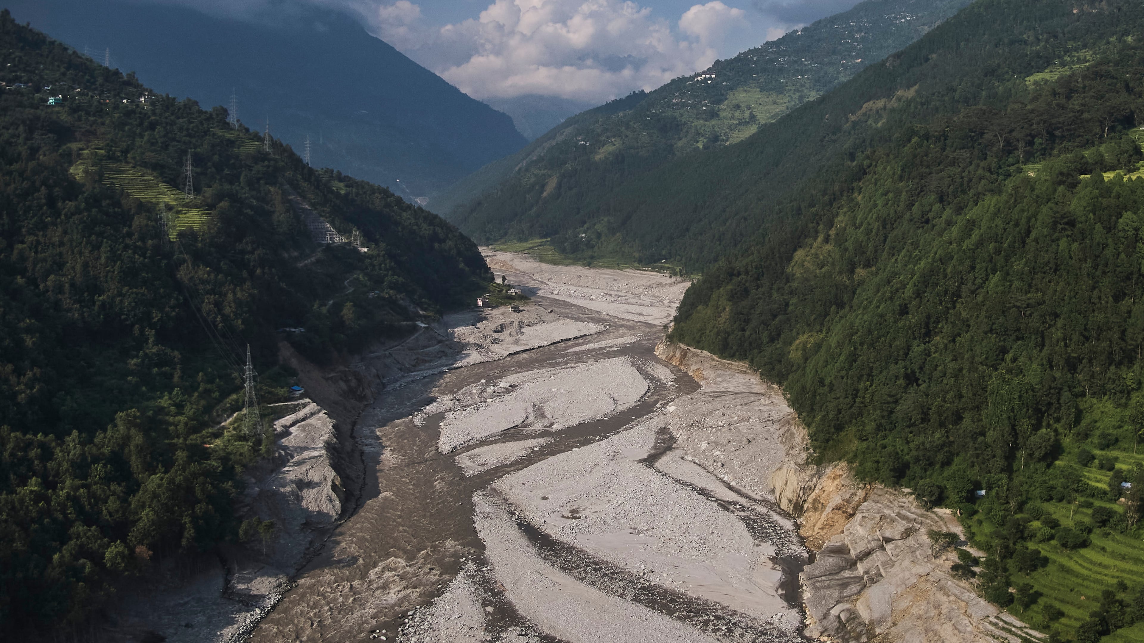 An aerial view shows the area where Khalte and other villages stood before being devastated by the flash floods in August, in Nepal's Rasuwa district, Oct. 2, 2026. (AP Photo/Niranjan Shrestha)