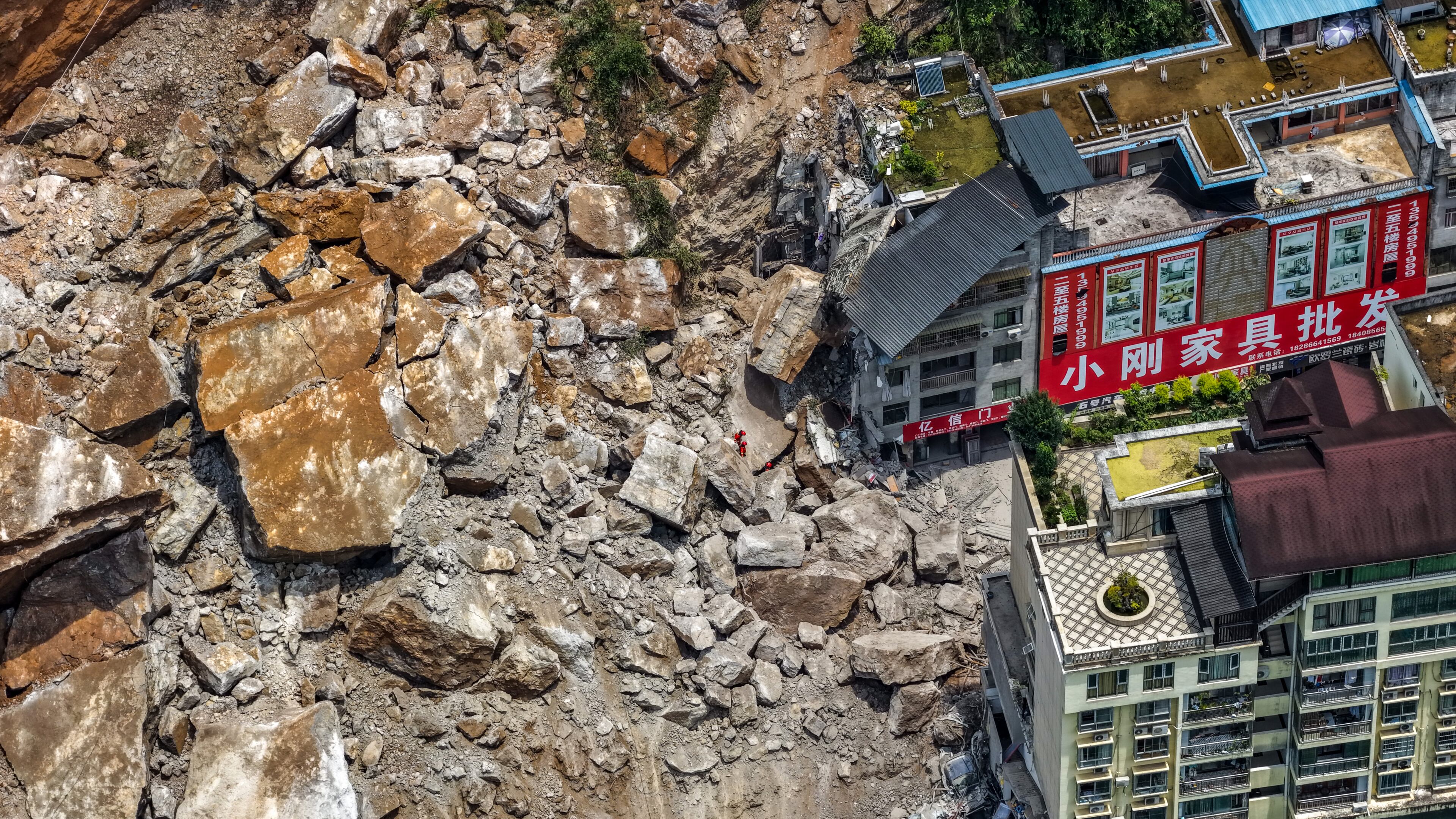 In this photo released by Xinhua News Agency, rescuers conduct search and rescue operation on the site of the landslide in Pengshui County in southwestern China's Chongqing on Friday, July 17, 2026. (Huang Wei/Xinhua via AP)