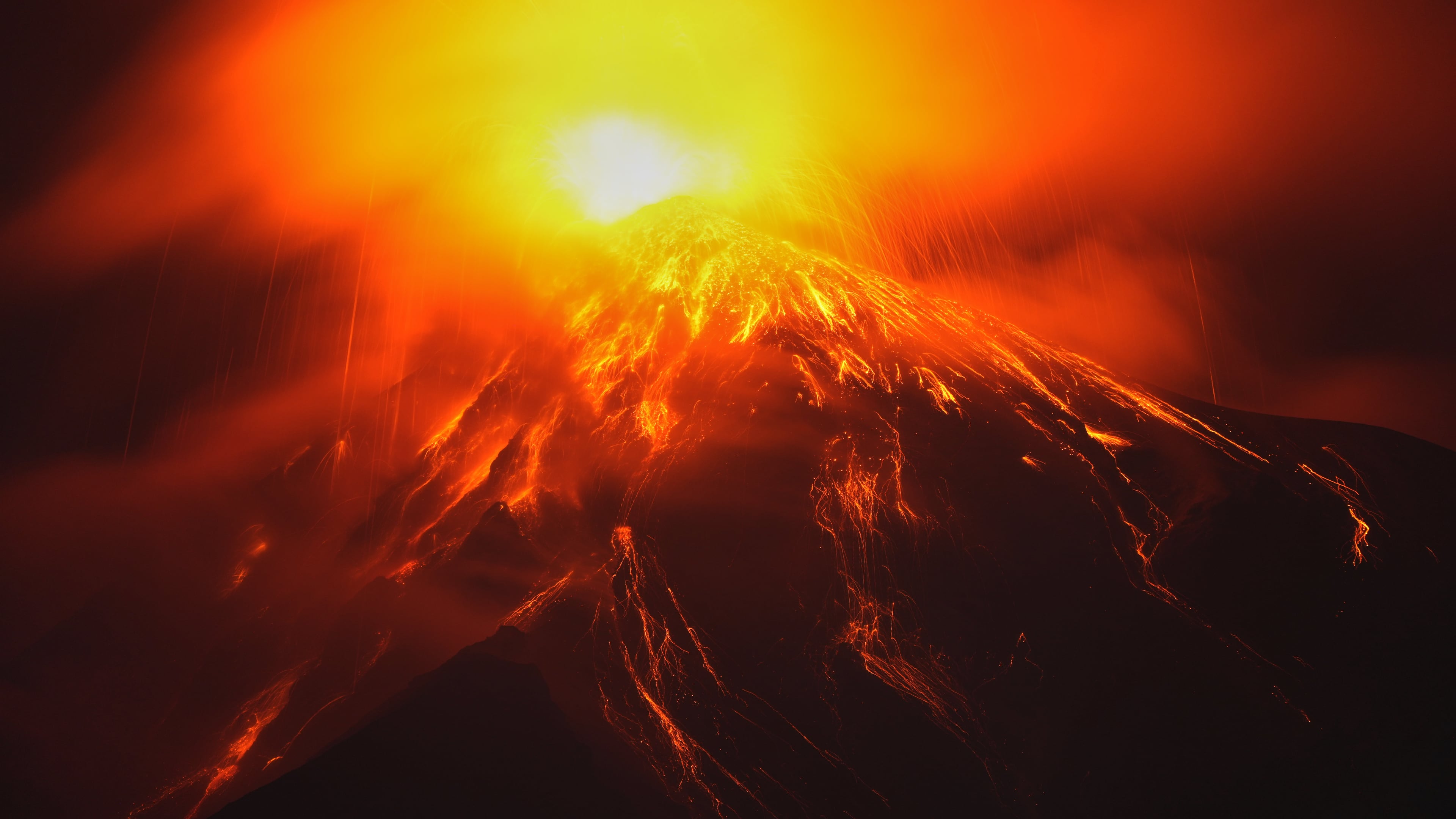 Lava flows out of the crater of the Fuego Volcano, as seen from San Juan Alotenango, Guatemala, Tuesday, Aug. 4, 2026. (AP Photo/Moises Castillo)
