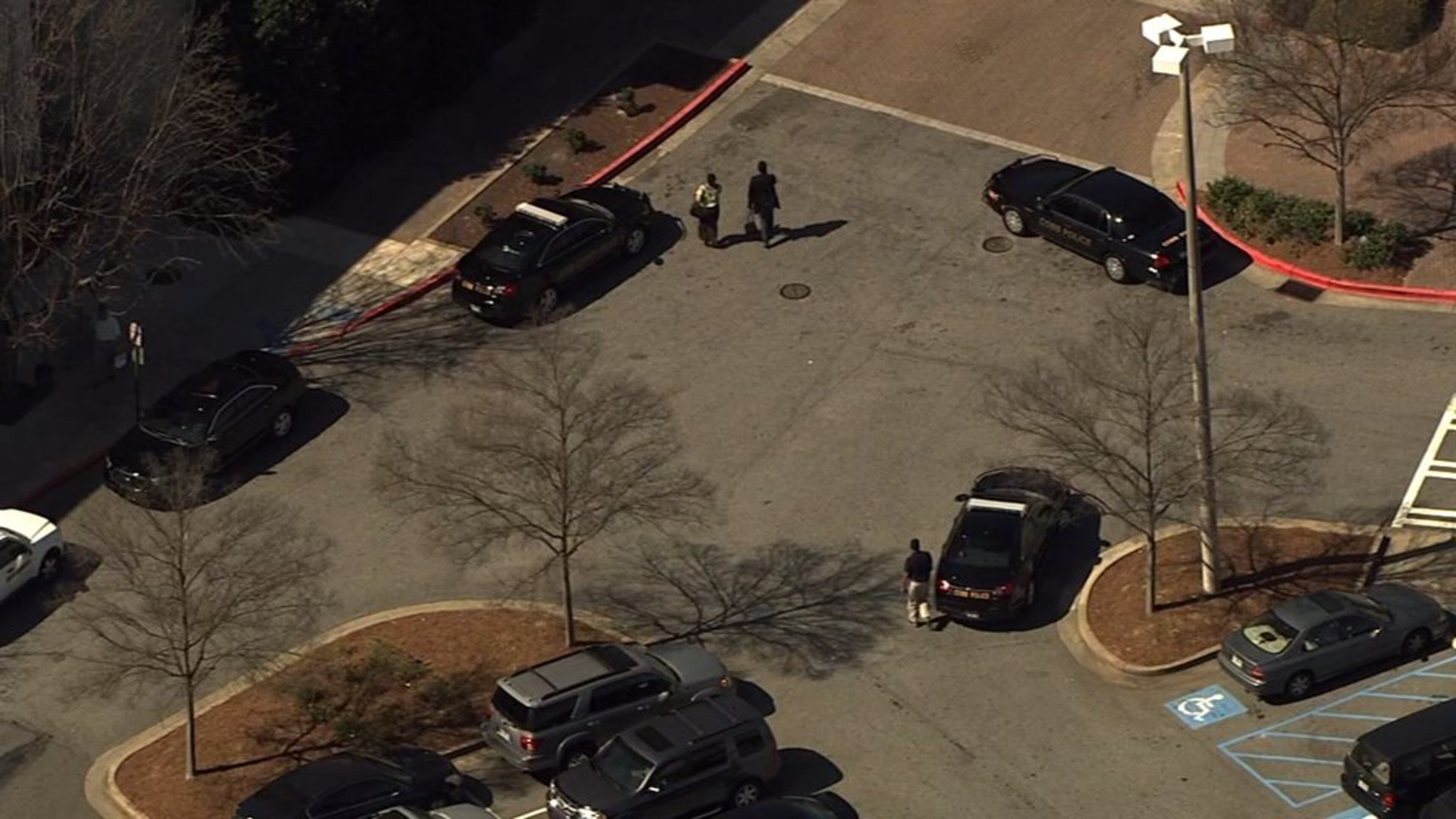 Three to six people, all of them in hoodies, allegedly robbed Diamond Solutions inside Cumberland Mall on Thurs., March 17, 2016. (Credit: Channel 2 Action News)