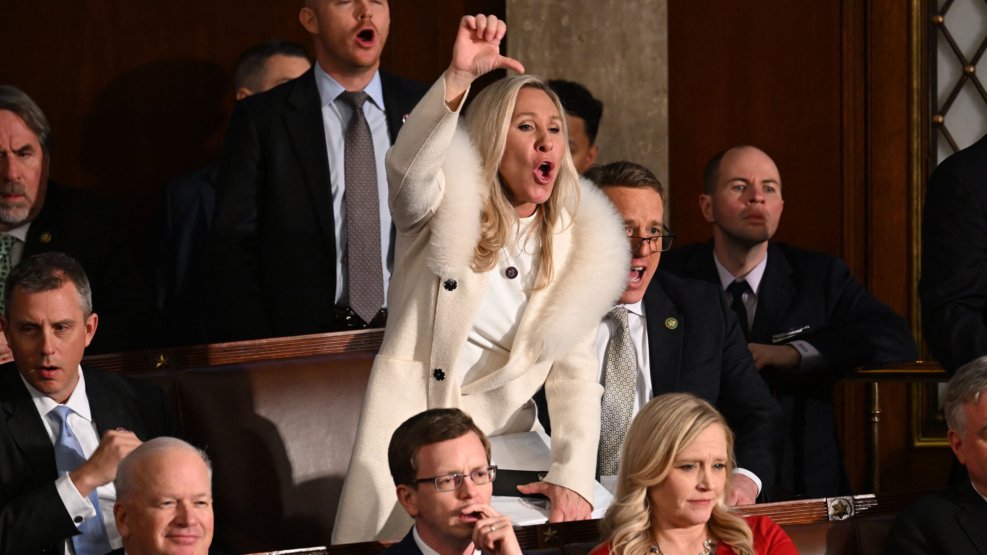 Rep. Marjorie Taylor Greene (R-GA) and Republican members of Congress react as President Joe Biden delivers the State of the Union address in the House Chamber of the U.S. Capitol on Tuesday, Feb. 7, 2023, in Washington, D.C. (Jim Watson/AFP/Getty Images/TNS)