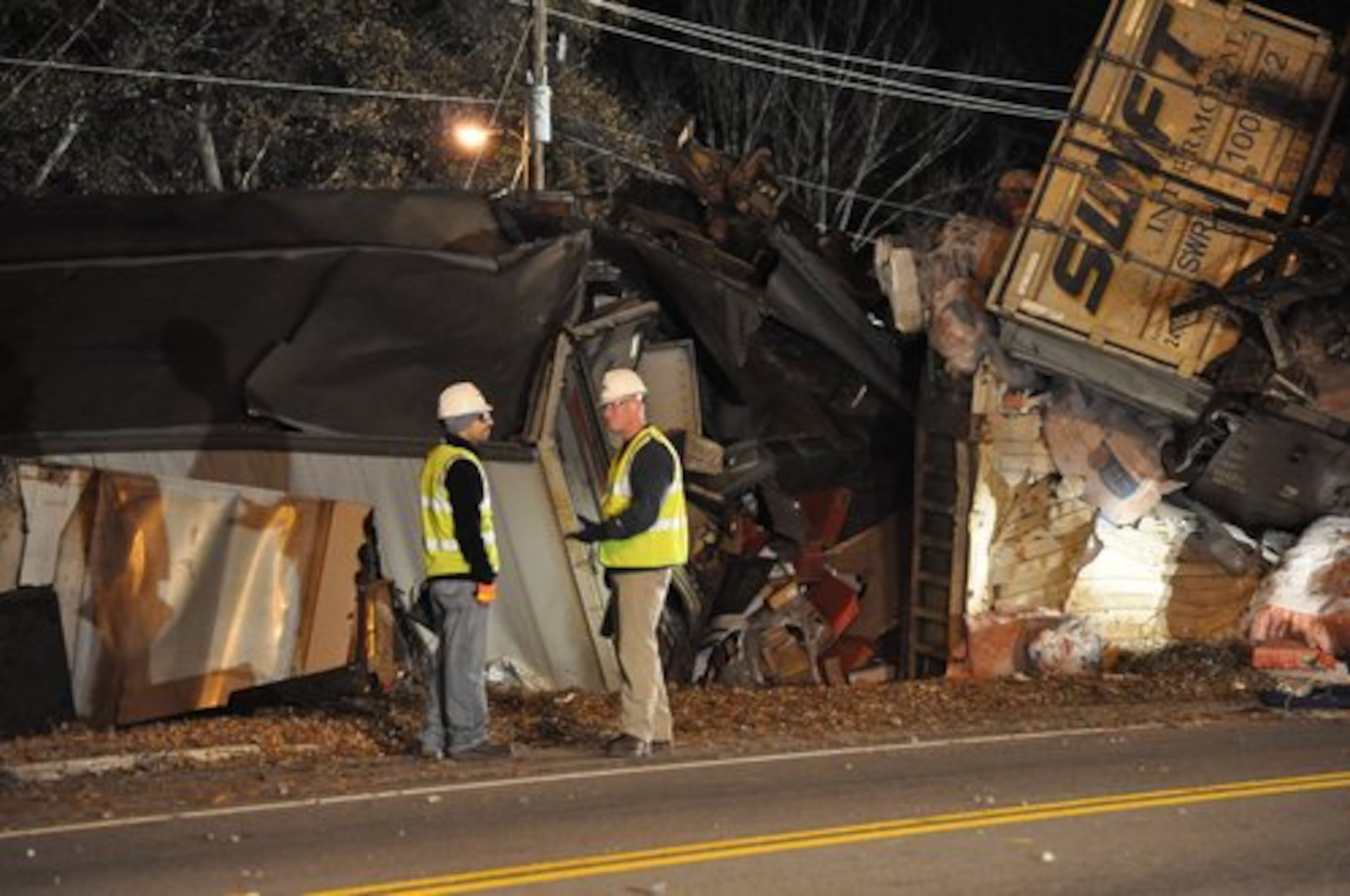 Several streets in Douglasville were shut Tuesday morning as crews began cleaning up an overnight train derailment. Dozens of the truck trailers were a twisted mess, some of them spilling cargo through gaping holes. Only one crossing remains open in Douglasville as crews assessed the damage.