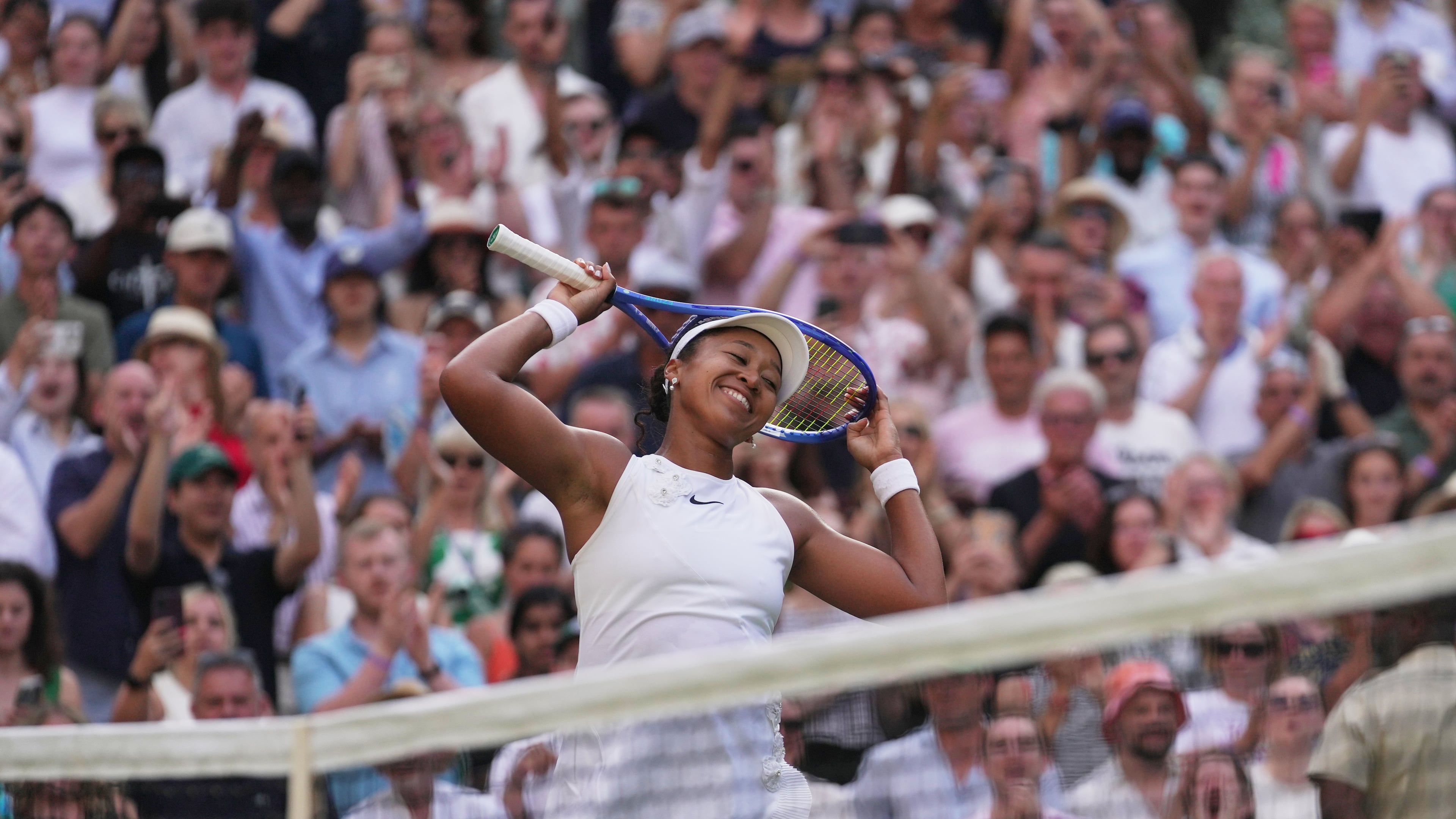 Naomi Osaka of Japan celebrates her victory against Aryna Sabalenka of Belarus in their fourth round women's singles match at the Wimbledon Tennis Championships in London, Sunday, July 5, 2026. (AP Photo/Brian Inganga)