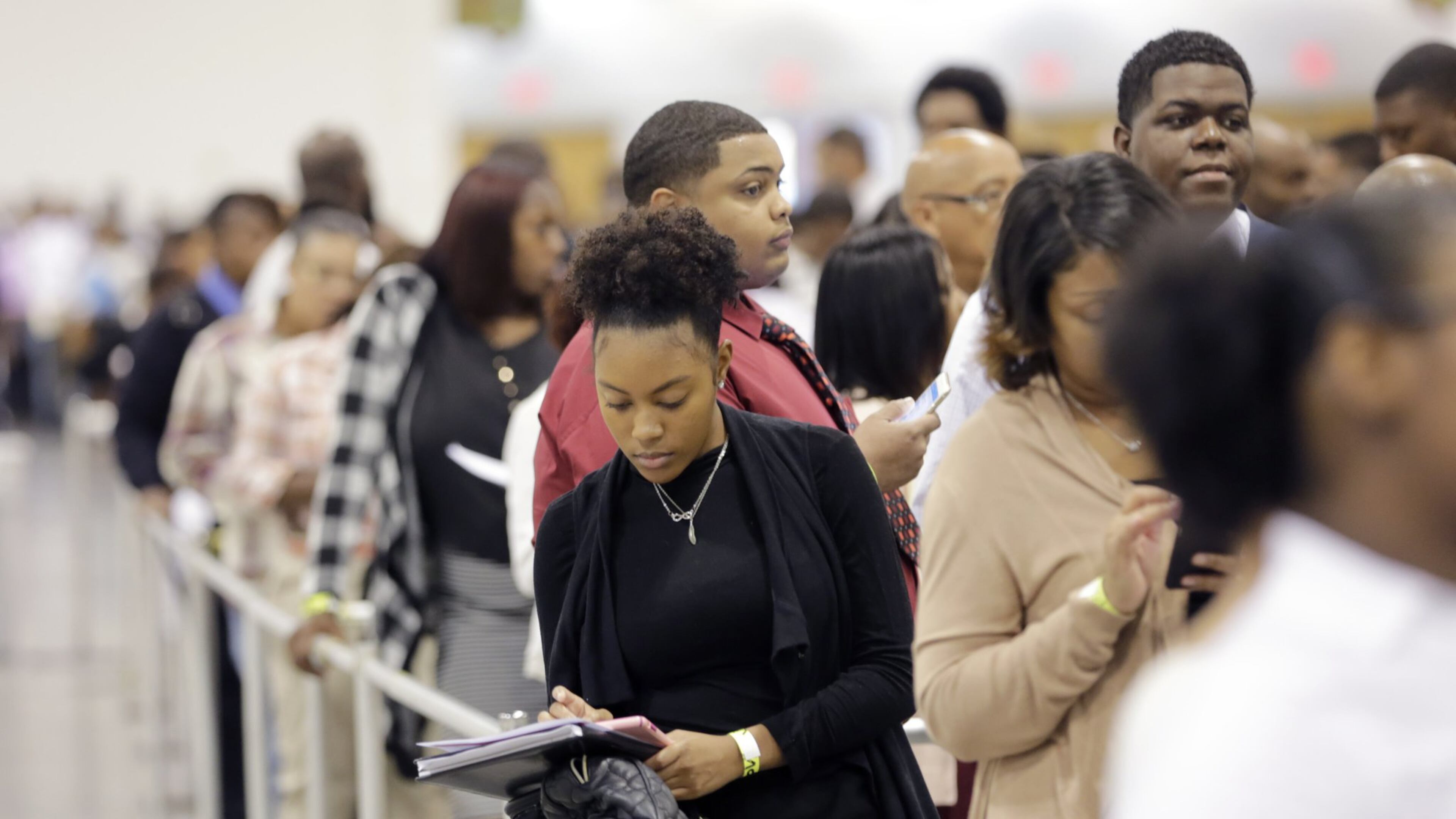 People lined up for more than 500 jobs offered at a recent Airport Community Job Fair. BOB ANDRES /BANDRES@AJC.COM