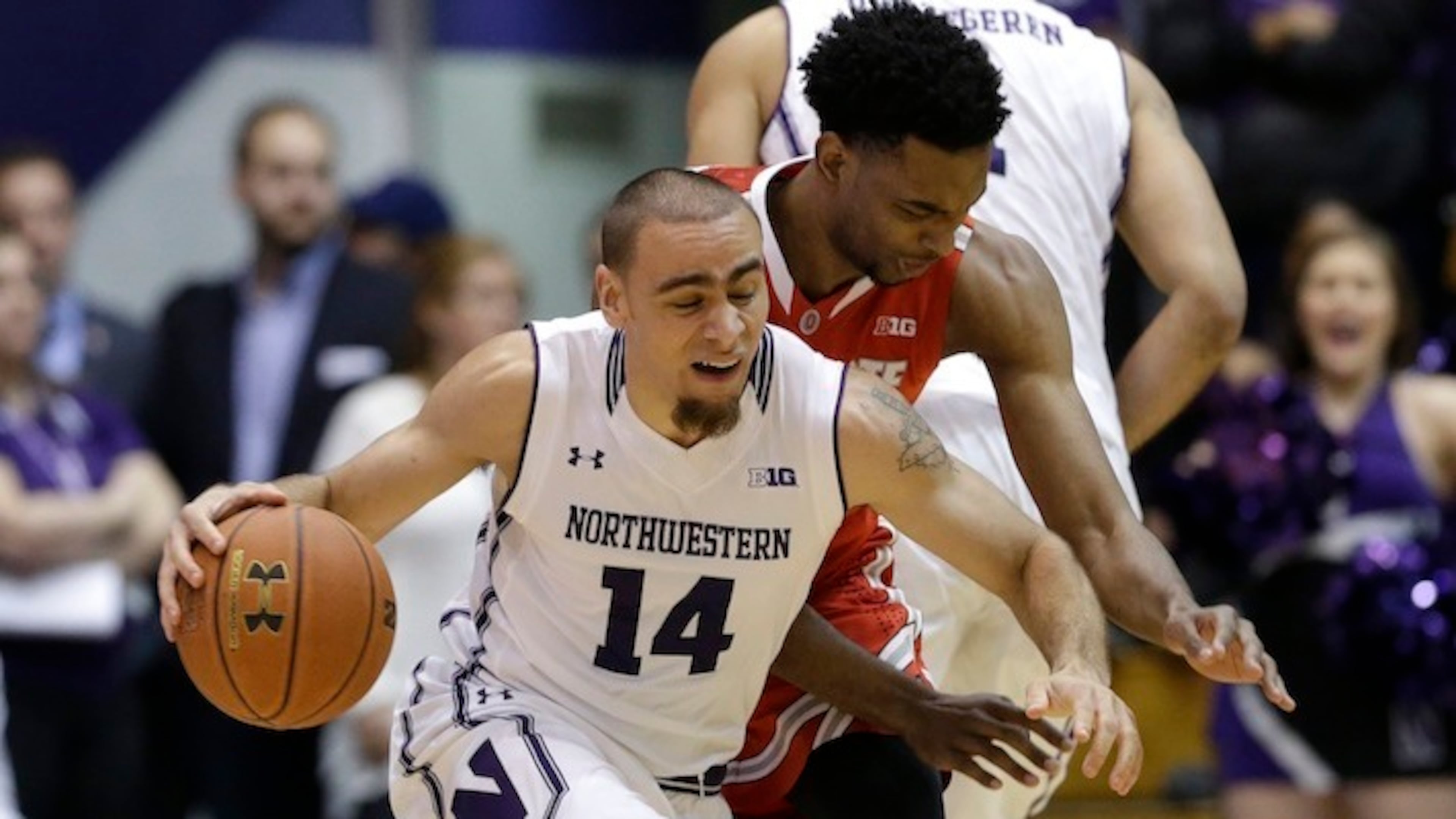 Northwestern guard Tre Demps (14) drives against Ohio State forward Keita Bates-Diop during the first half of an NCAA college basketball game on Wednesday, Jan. 6, 2016, in Evanston, Ill. (AP Photo/Nam Y. Huh)
