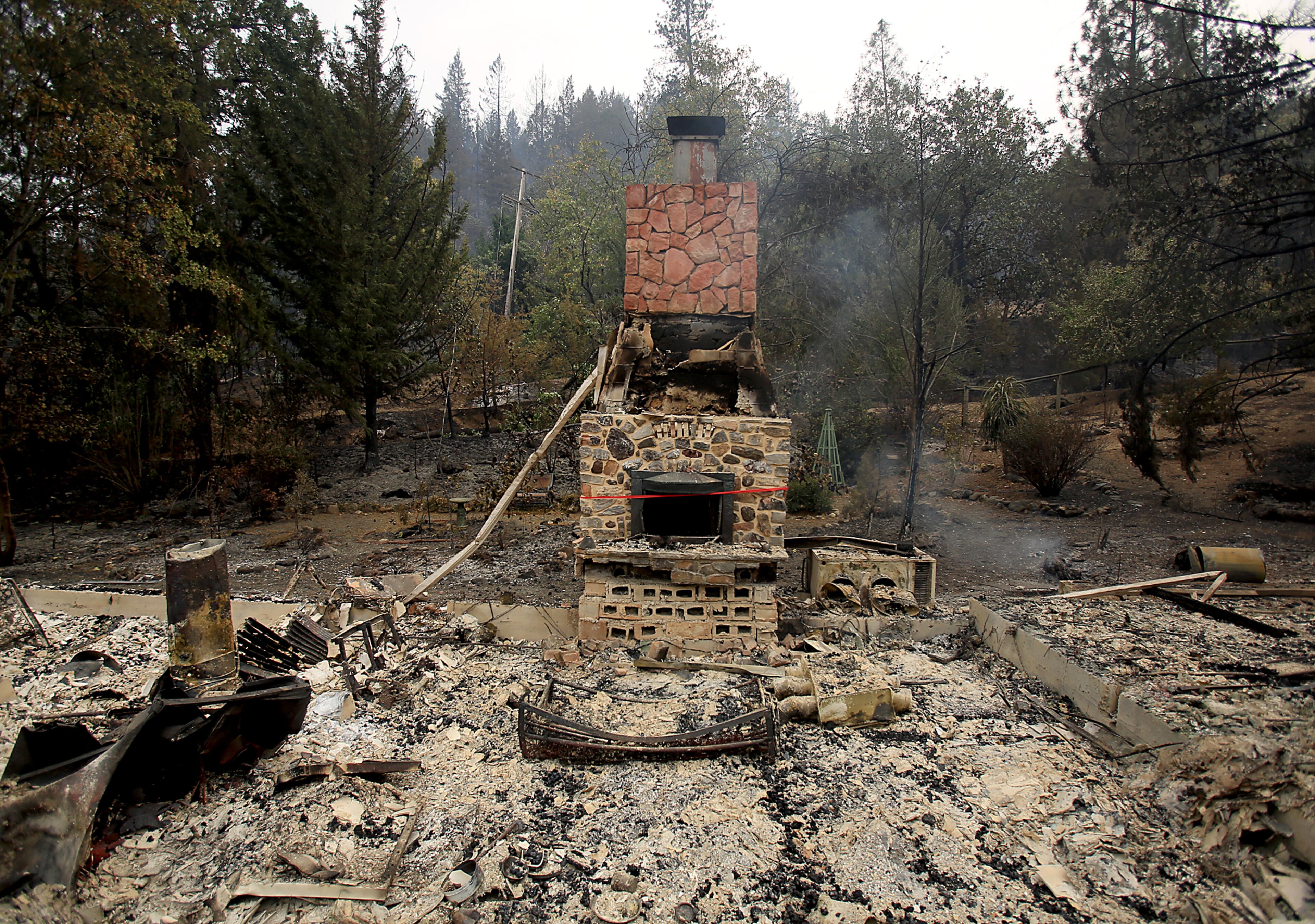 This Monday, Sept. 14, 2015, photo shows the remains of Barbara McWilliams' home, according to the The Press Democrat, in the Anderson Springs community in Middletown, Calif. McWilliams was found dead in the ruins of her home that was destroyed by a wildfire according to Lake County Sheriff Brian Martin. (Kent Porter/The Press Democrat via AP) MANDATORY CREDIT