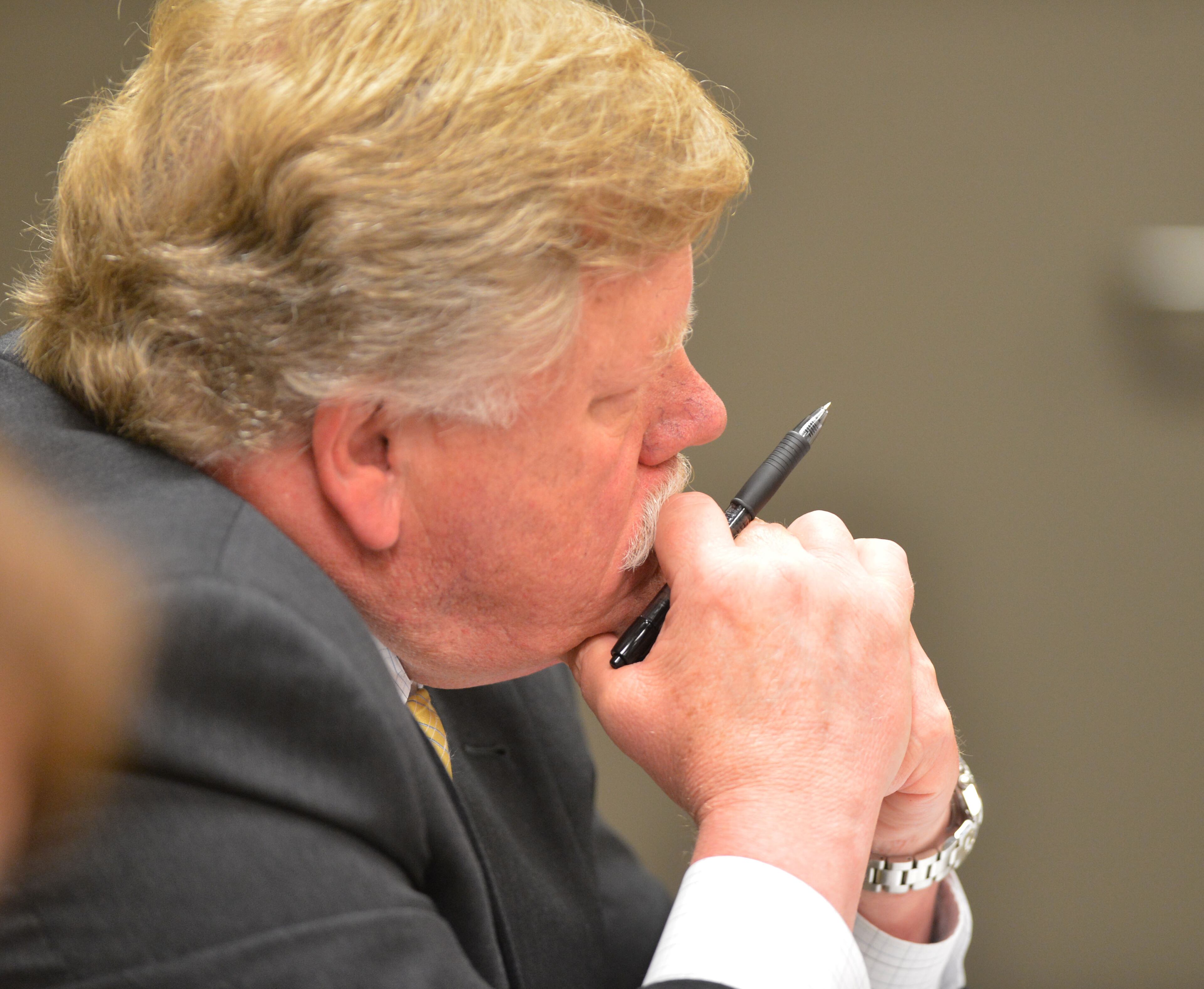Defense attorney John Burdgess listens to testimony in Magistrate Court Friday. The parents of Emani Moss are shown during their first court appearance before Gwinnett County Chief Magistrate Kristina Blum in Gwinnett County Magistrate Court Friday November 8, 2013. Eman and Tiffany Moss, of Lawrenceville, Georgia, were arrested and charged with murder, concealing a body, and child cruelty after police say they had starved to death their daughter, Emani, 10, and then set her body on fire to cover up the crime.