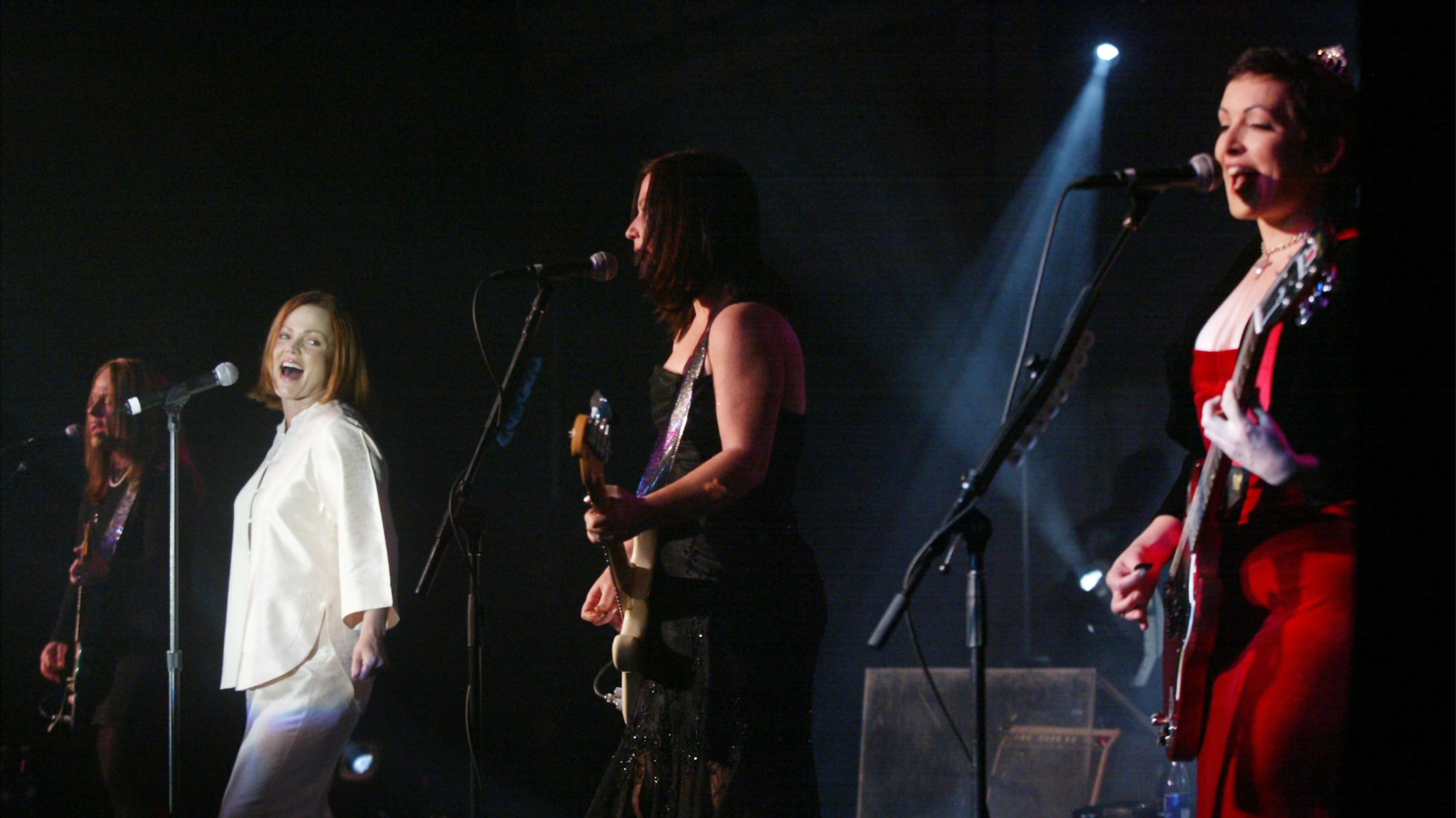 401745 06: The Go-Gos (L to R) Charlotte Caffey, Belinda Carlisle, Kathy Valentine, Jane Wiedlin perform at the Larry King Cardiac Foundation gala March 1, 2002 in Washington, DC. The Foundation was established in 1989 to provide funding for life-saving cardiac procedures for individuals who, due to limited means and inadequate insurance who would otherwise be unable to receive treatment. (Photo by Mark Wilson/Getty Images)