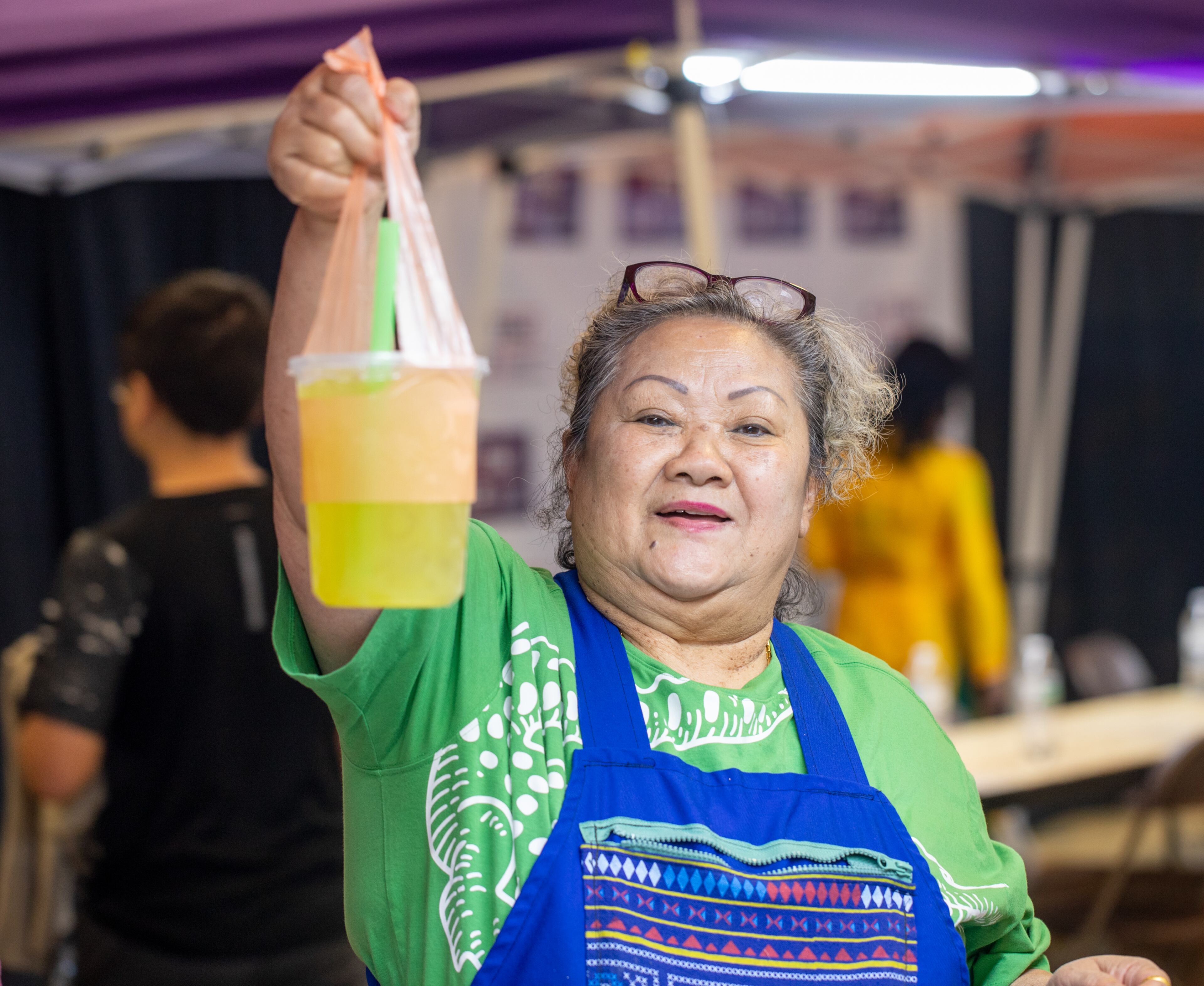Van K’tayong serves up sugar cane drink as the festivities of the Lunar New Year begin on Saturday, Feb 3, 2024. The Vietnamese American Community of Georgia hosts the celebration at Plaza Las Americas in Lilburn where dragon and lion dancing, firecrackers and drumming opened the weekend. The celebration continues on Sunday and includes traditional food, music and cultural festivities. (Jenni Girtman for The Atlanta Journal-Constitution)
