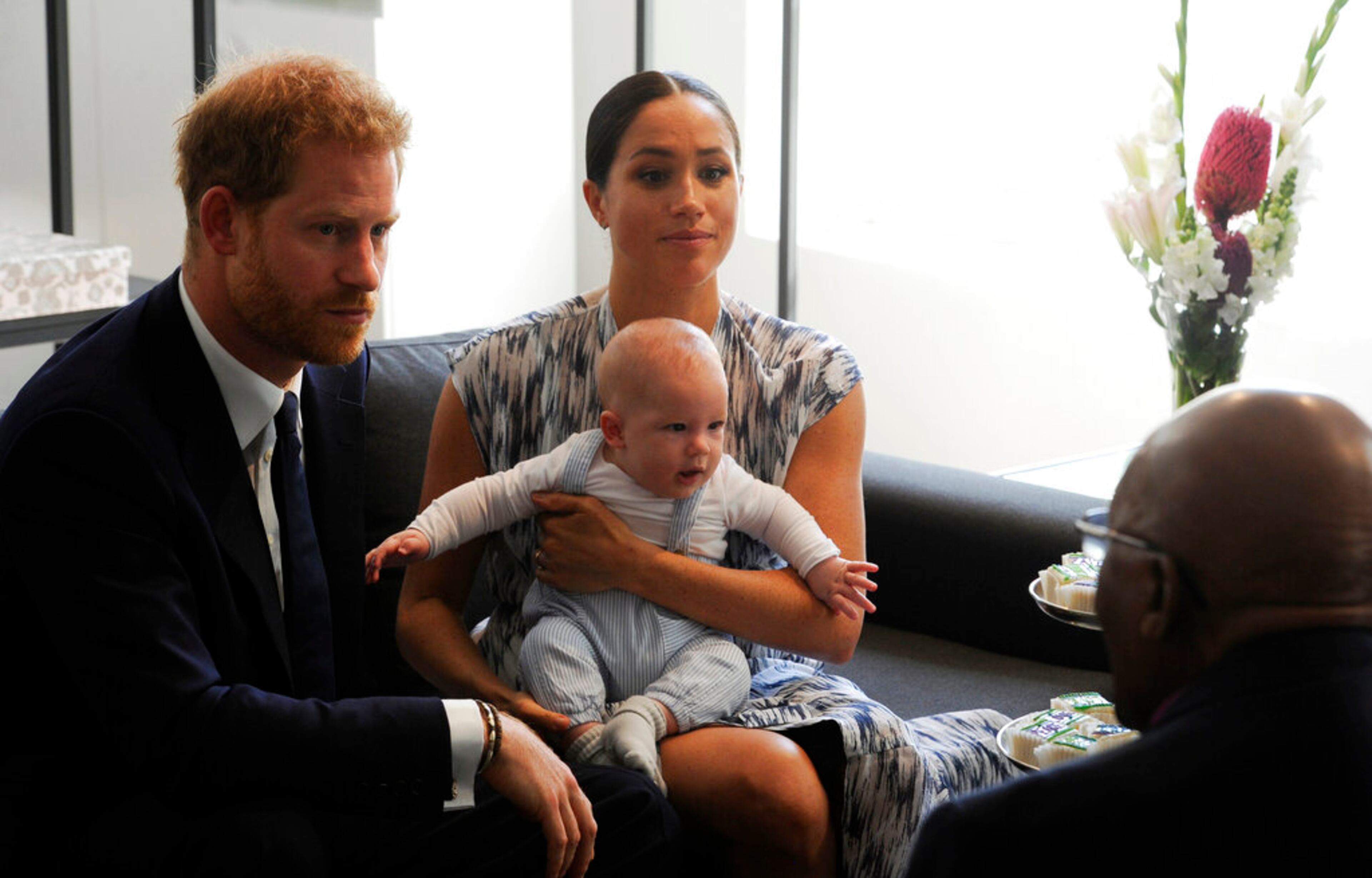 Britain's Prince Harry and Meghan, Duchess of Sussex, holding their son Archie, meet with Anglican Archbishop Emeritus, Desmond Tutu in Cape Town, South Africa, Wednesday Sept. 25, 2019. The royal couple are on the third day of their African tour. (Henk Kruger/African News Agency via AP, Pool)