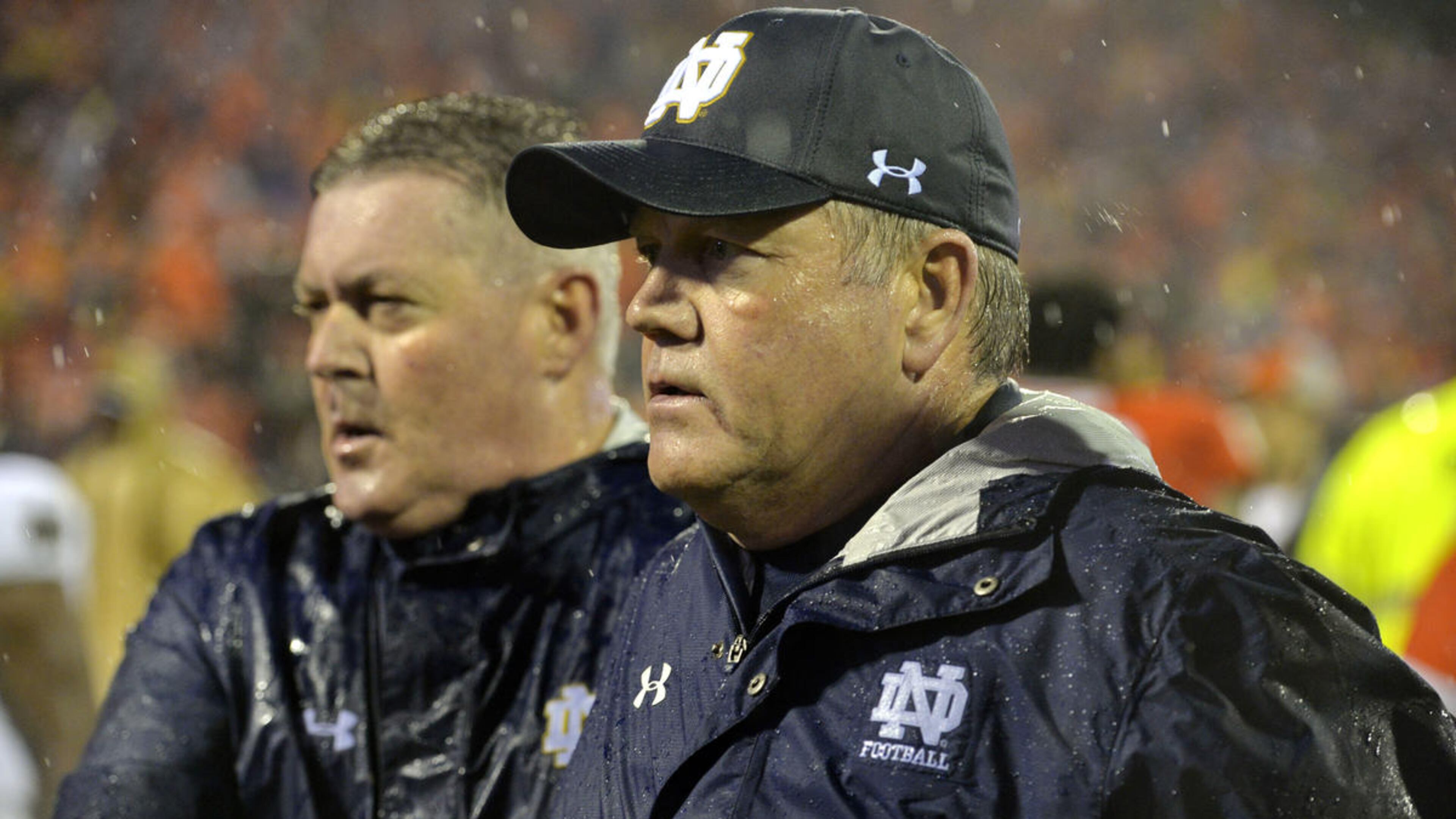 Notre Dame head coach Brian Kelly is escorted off of the field after an NCAA college football game against Clemson Saturday, Oct. 3, 2015, in Clemson, S.C. Clemson won 24-22. (AP Photo/Richard Shiro)