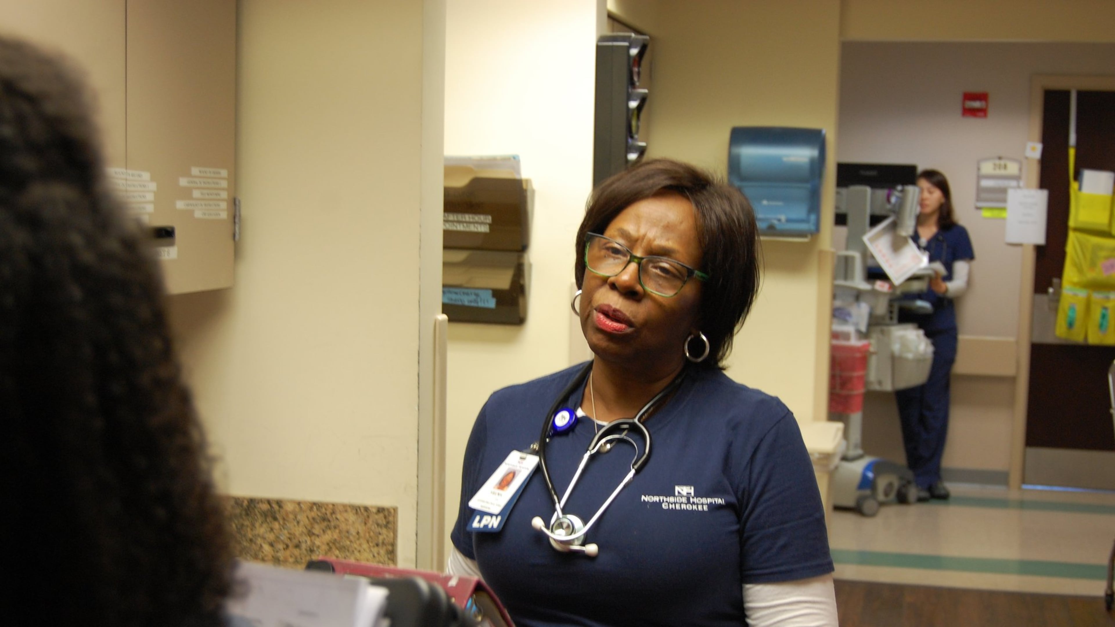 Velma Blackwell, a nurse at Northside Hospital Cherokee, checks in with her nursing team before starting rounds. Blackwell, 71, was the first African-American allowed to work as a nurse at the hospital. CONTRIBUTED