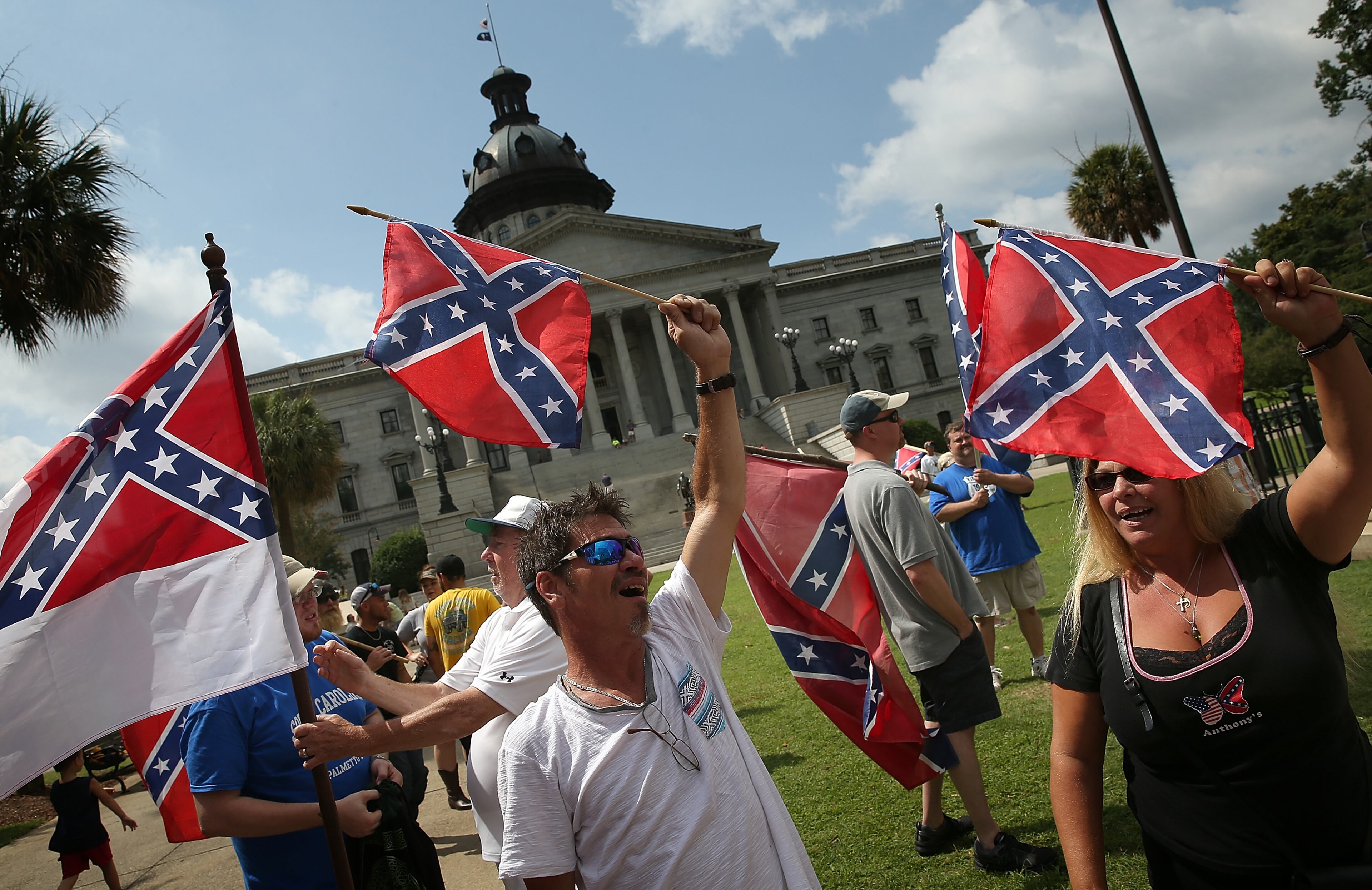 COLUMBIA, SC - JUNE 27: Demonstrators protest at the South Carolina State House calling for the Confederate flag to remain on the State House grounds June 27, 2015 in Columbia, South Carolina. Earlier in the week South Carolina Gov. Nikki Haley expressed support for removing the Confederate flag from the State House grounds in the wake of the nine murders at Mother Emanuel A.M.E. Church in Charleston, South Carolina. (Photo by Win McNamee/Getty Images)