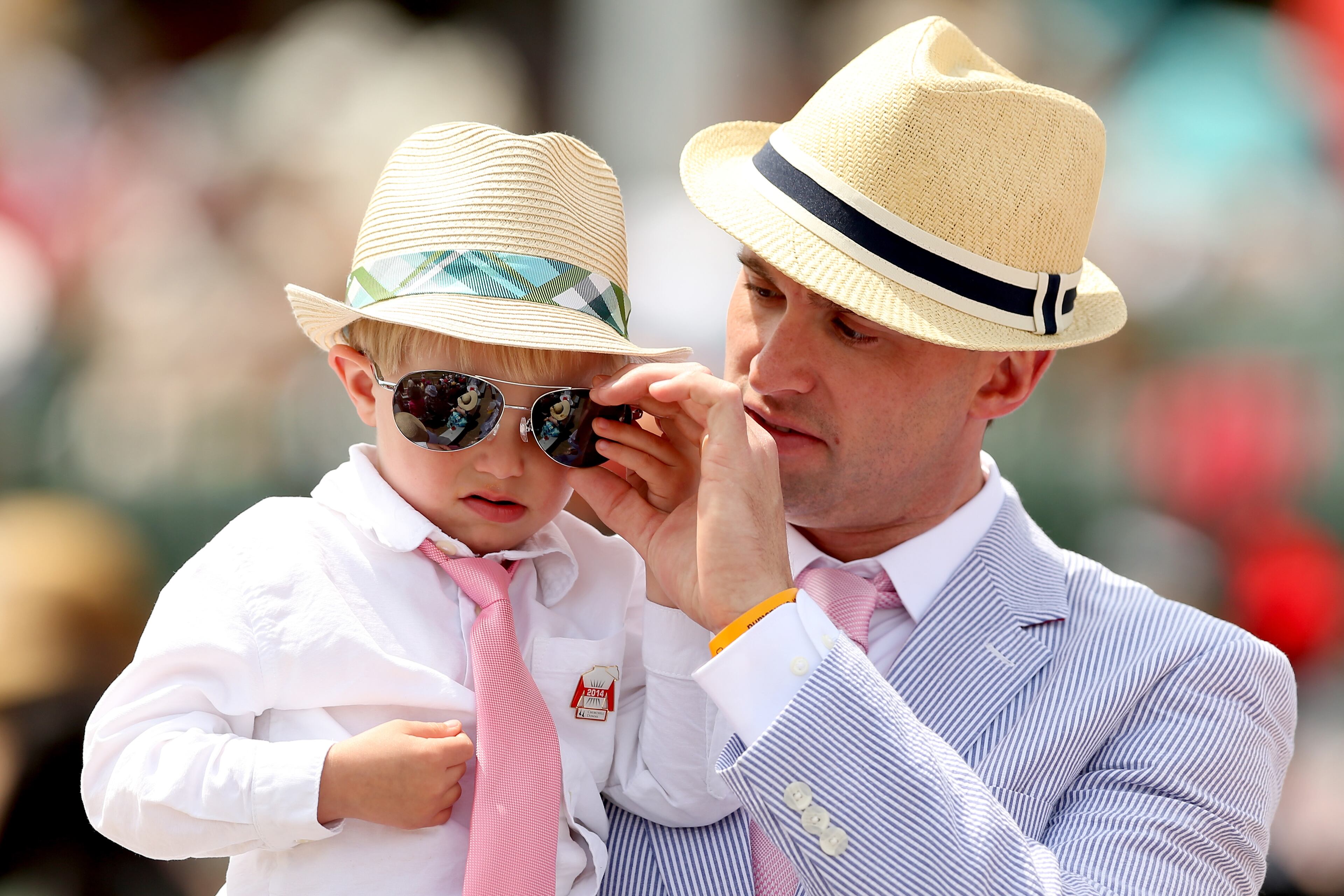 LOUISVILLE, KY - MAY 03: Race fans wearing a festive hat attend the 140th running of the Kentucky Derby at Churchill Downs on May 3, 2014 in Louisville, Kentucky. (Photo by Matthew Stockman/Getty Images)