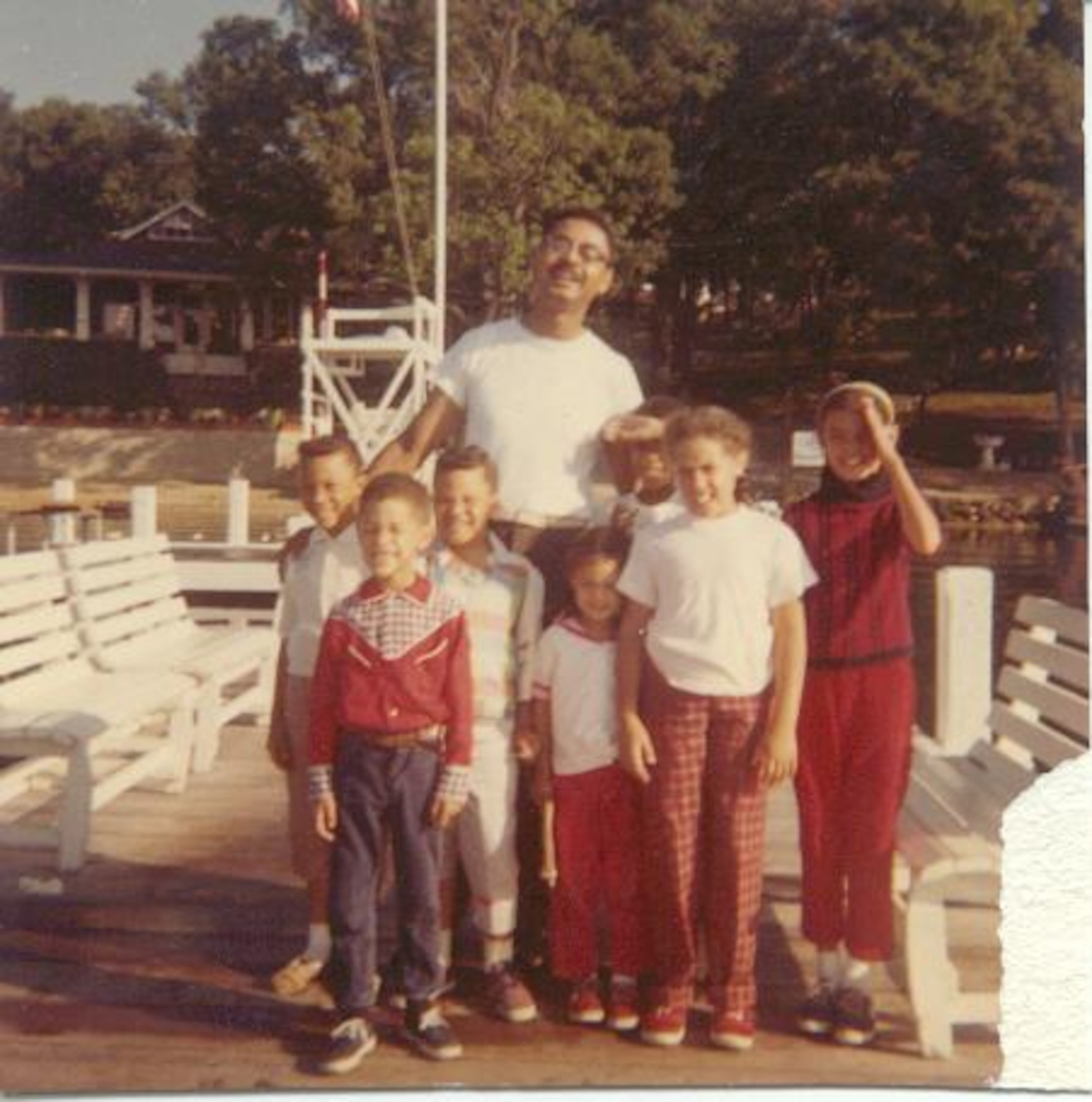 A young Frank Richards, in the cowboy shirt at front left, and his sister Sue, in the white T-shirt on the right, grew up in the familial and supportive atmosphere of Homer G. Phillips Hospital in St. Louis, the largest African American teaching hospital in the United States. Here, they and other children pose on vacation with Dr. Jerome Williams, Moorehouse graduate and a heroic figure in the hospital's history. Photo by Chris Quinn/cquinn@ajc.com