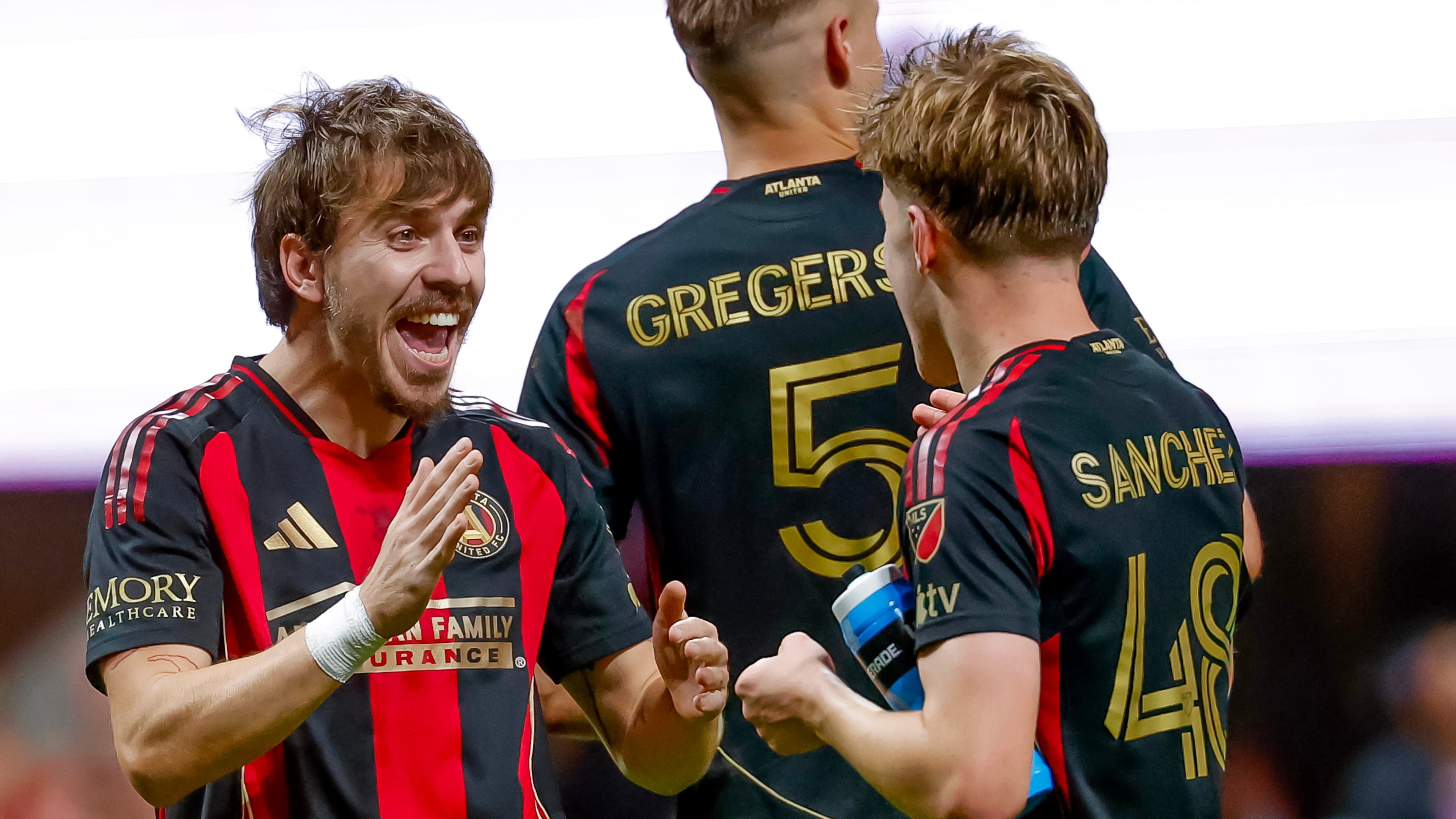 Atlanta United forward Saba Lobjanidze, left, celebrates with midfielder Cooper Sanchez, right after their team defeated CF Montreal in an MLS soccer match, Saturday, May 2, 2026, in Atlanta. (AP Photo/Erik S. Lesser)