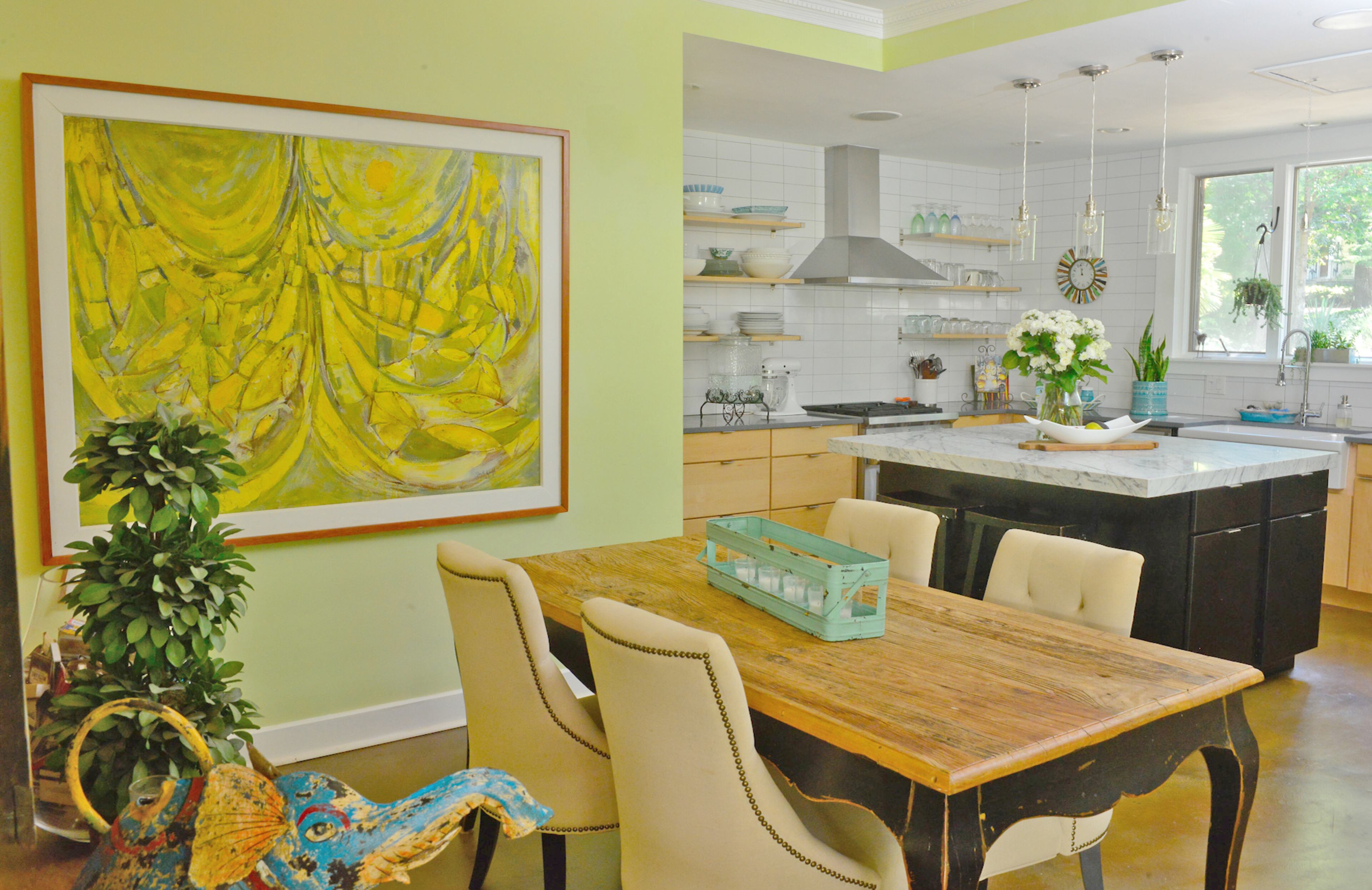 The Moores, who work for The Creative Circus, renovated their kitchen by removing a wall with a swing door to make the area more open. Contractor Robert Estes, who is Finny's brother, helped them renovate the home.