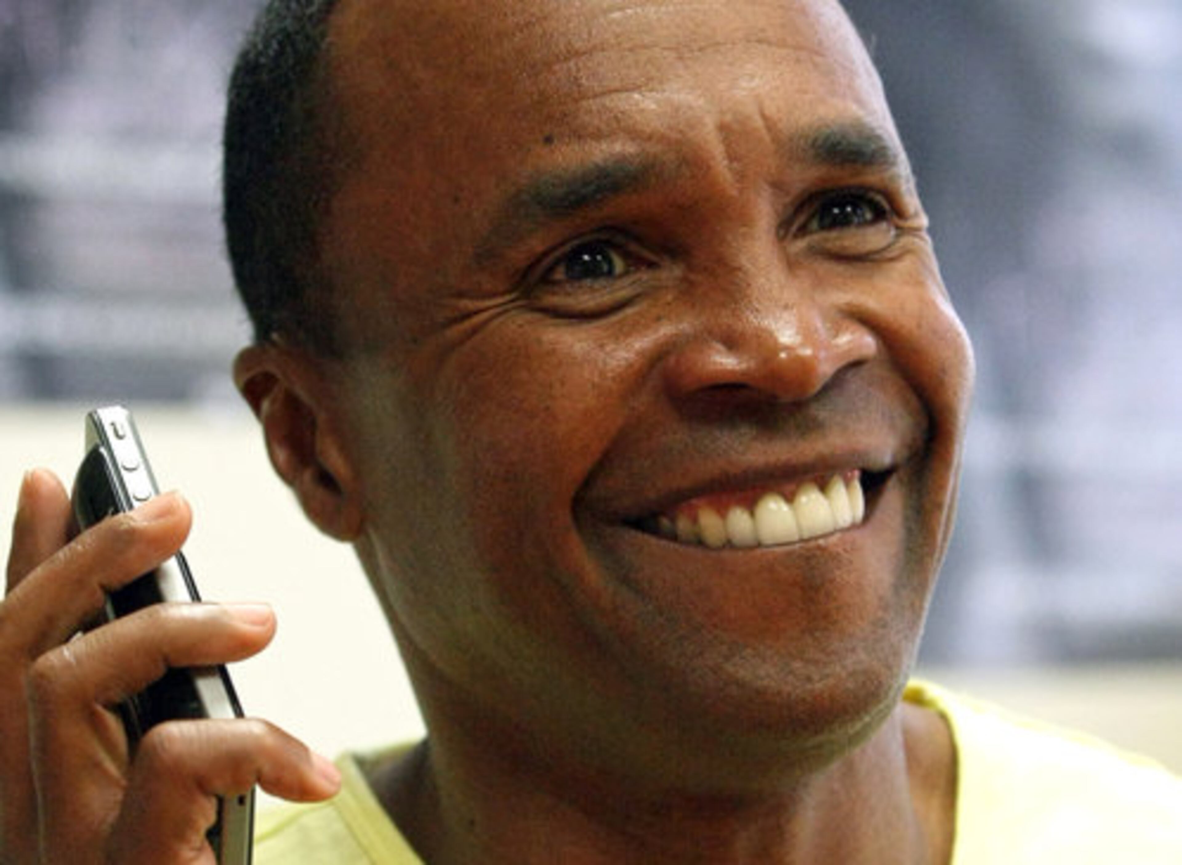 Before an interview at WAOK and WVEE headquarters in Atlanta, Leonard uses his smart phone to play a song he danced to while a contestant on "Dancing with the Stars."