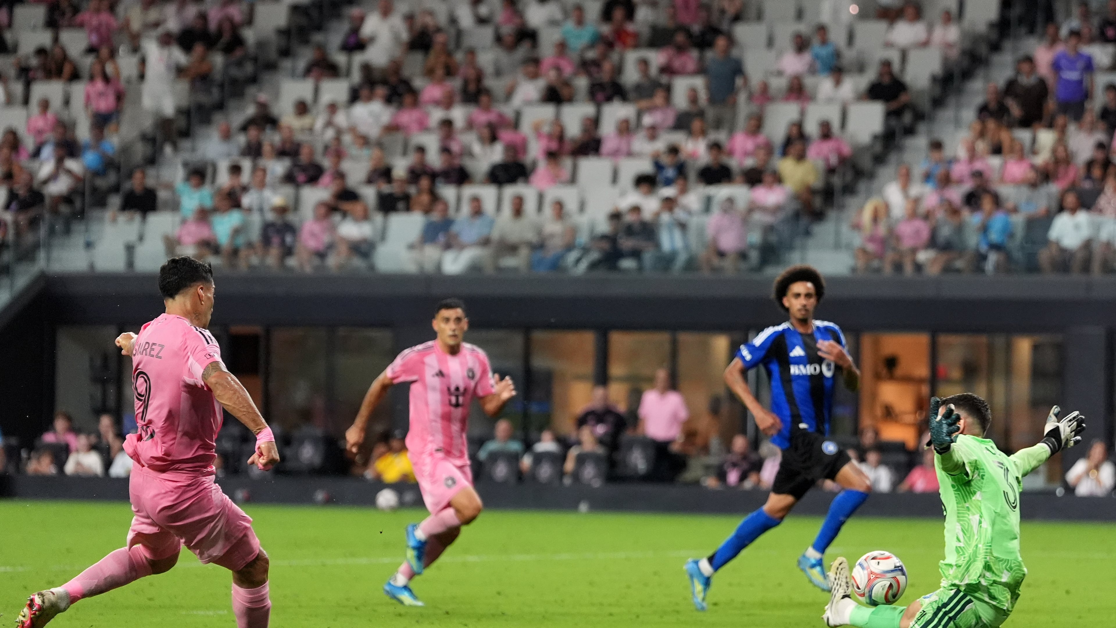 Inter Miami forward Luis Suarez scores his side's fourth goal past CF Montreal goalkeeper Thomas Gillier (31) during the second half of an MLS soccer match, Saturday, Aug. 29, 2026, in Miami. (AP Photo/Rebecca Blackwell)