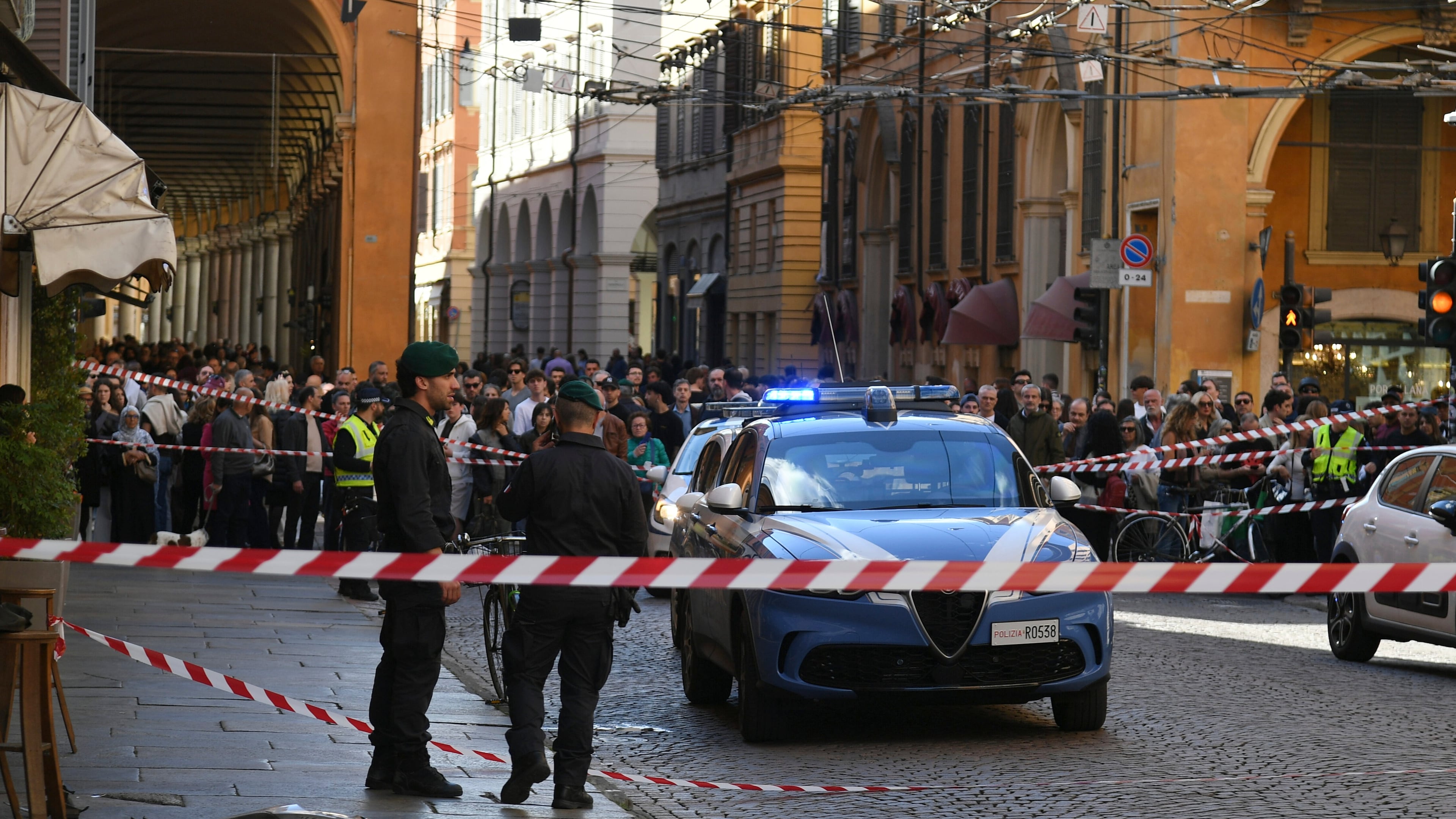 Financial Police patrol a scene after a car incident in a street of Modena, Italy, Saturday, May 16, 2026. (Lapresse via AP)