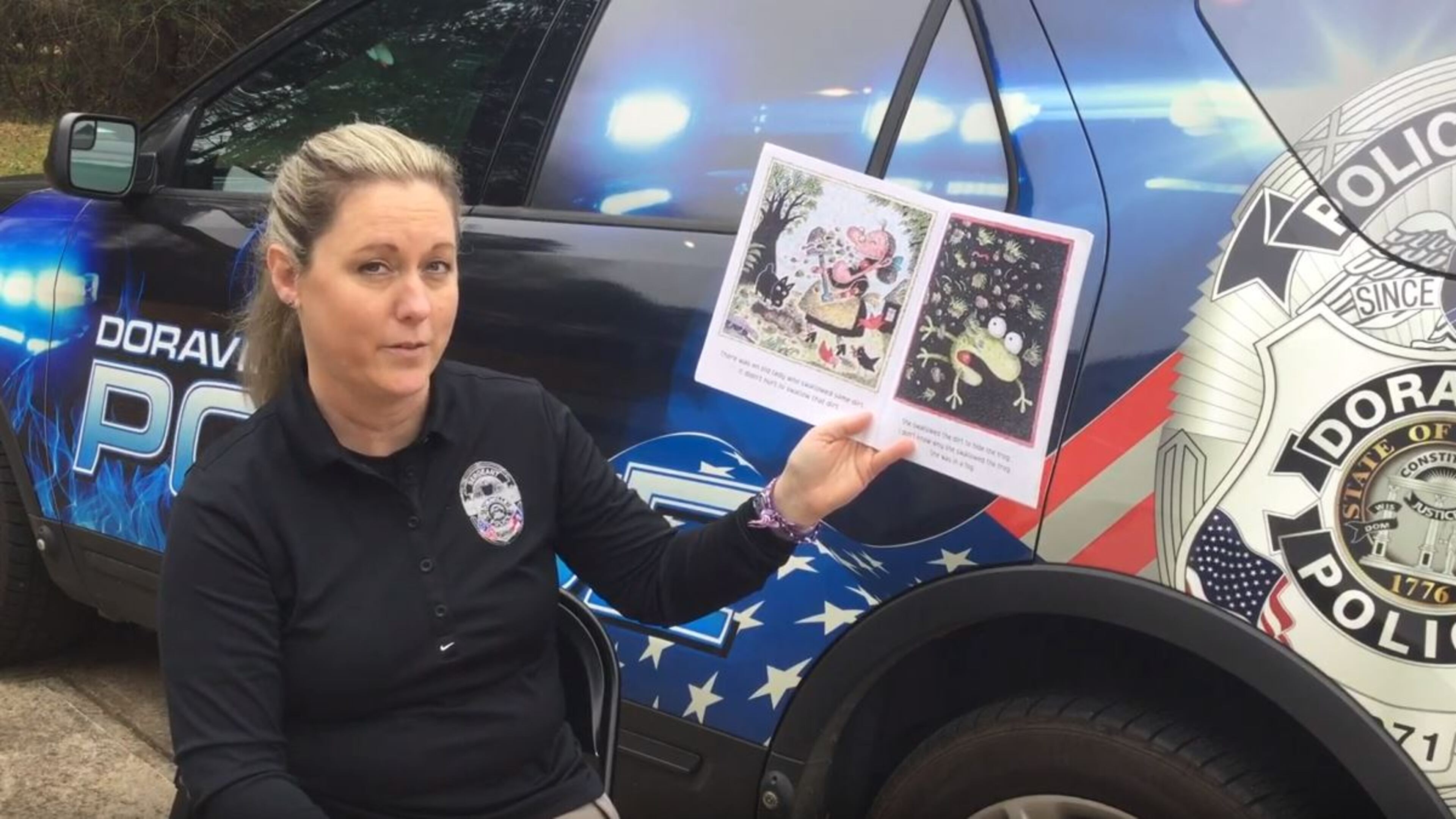 Doraville Police Sgt. Kari Lopez, in a video she made reading to her students at Hightower and Oakcliff elementary schools. COURTESY OF THE DORAVILLE POLICE DEPARTMENT