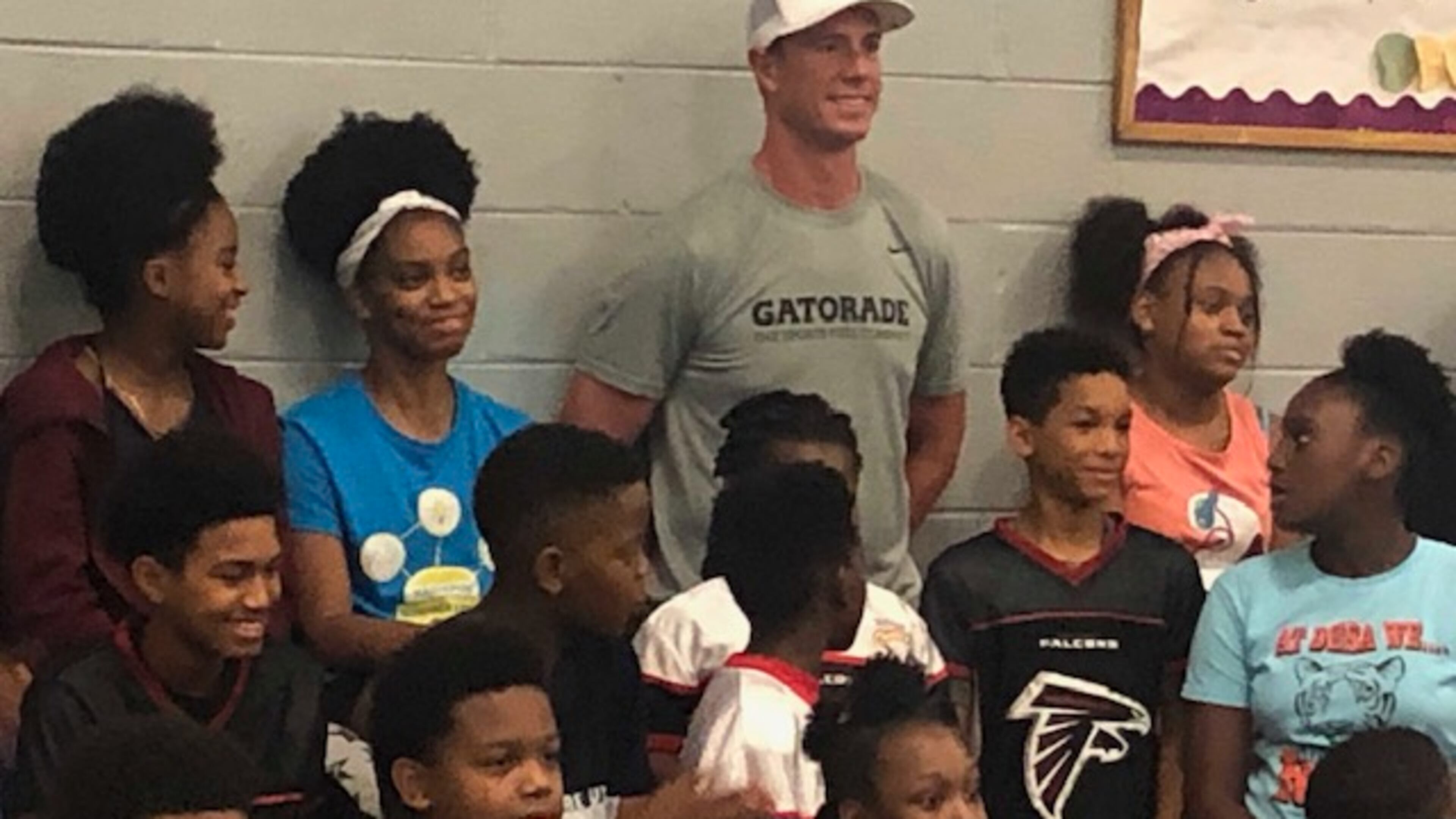 Falcons quarterback Matt Ryan posing with students at the Samuel Jones Boys and Girls Club of Metro Atlanta on Thursday. (By D. Orlando Ledbetter/dledbetter@ajc.com)