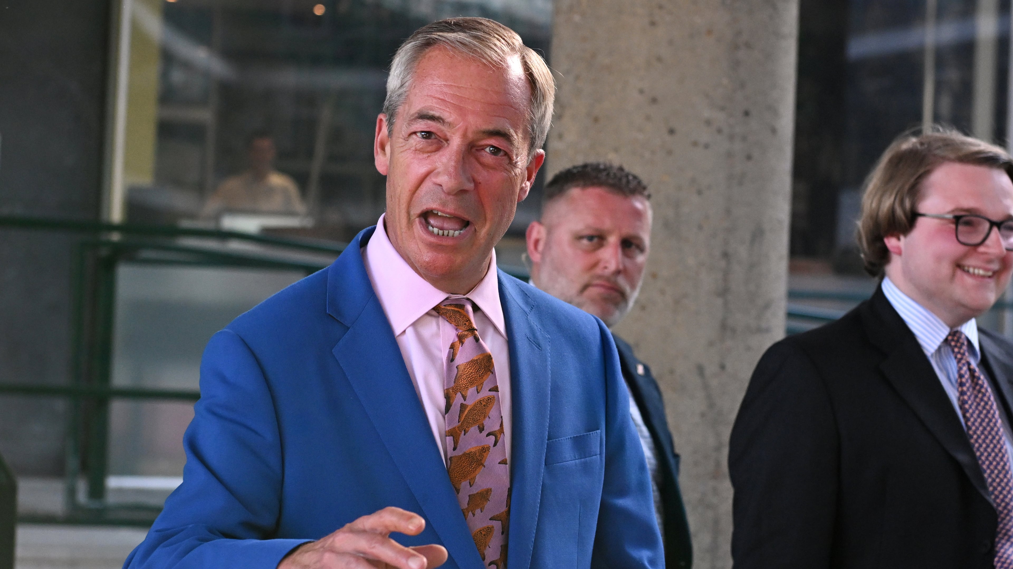 Britain's Reform UK leader Nigel Farage leaves Milbank Tower after he said he'll quit his Parliament seat and seek reelection in London, Tuesday, July 7, 2026.(AP Photo/Thomas Krych)