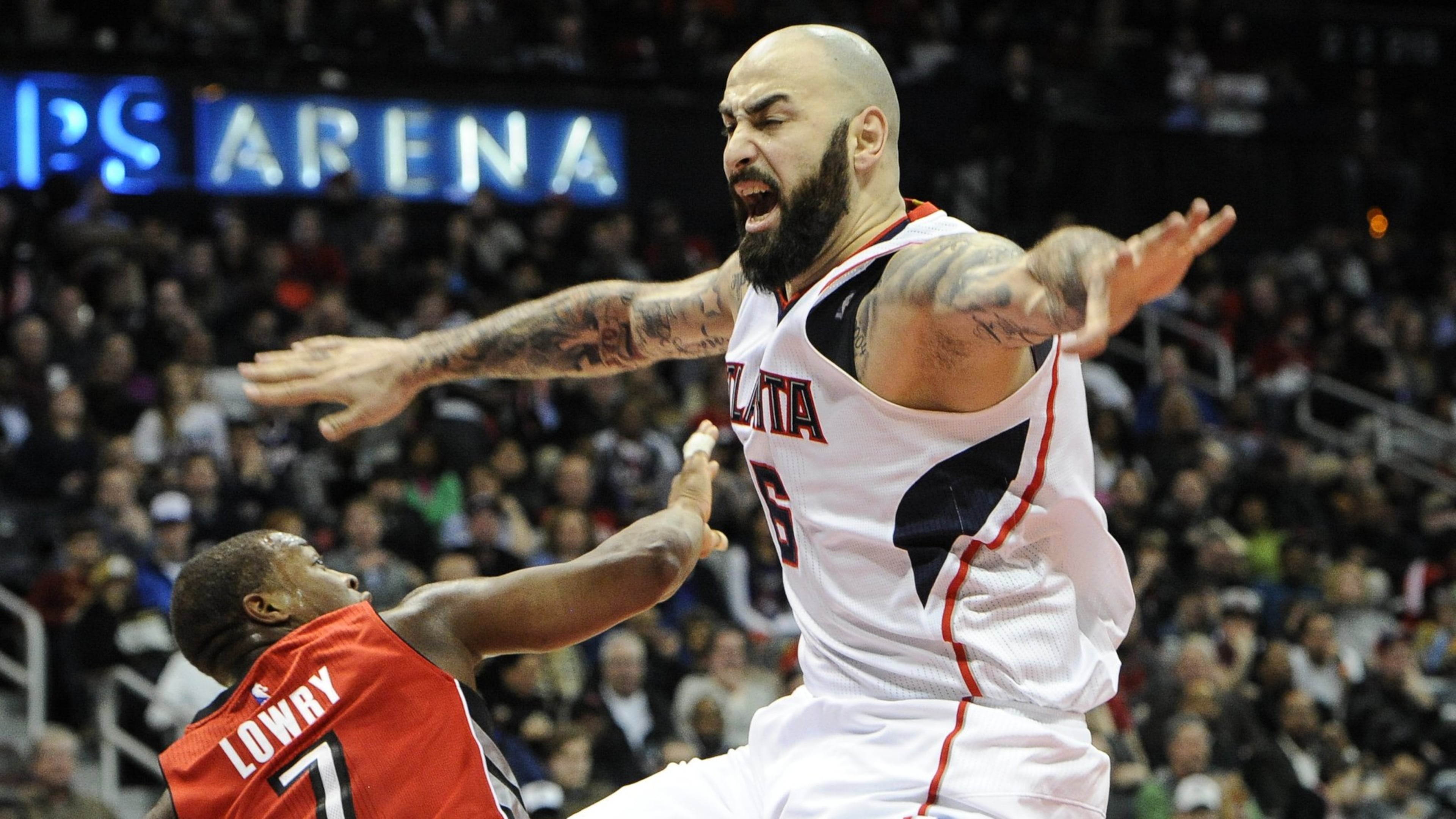 Atlanta Hawks forward Pero Antic (6), of Macedonia, plays against Toronto Raptors guard Kyle Lowry (7) during the second half of an NBA basketball game, Friday, Feb. 20, 2015, in Atlanta. Toronto won 105-80. (AP Photo/John Amis)