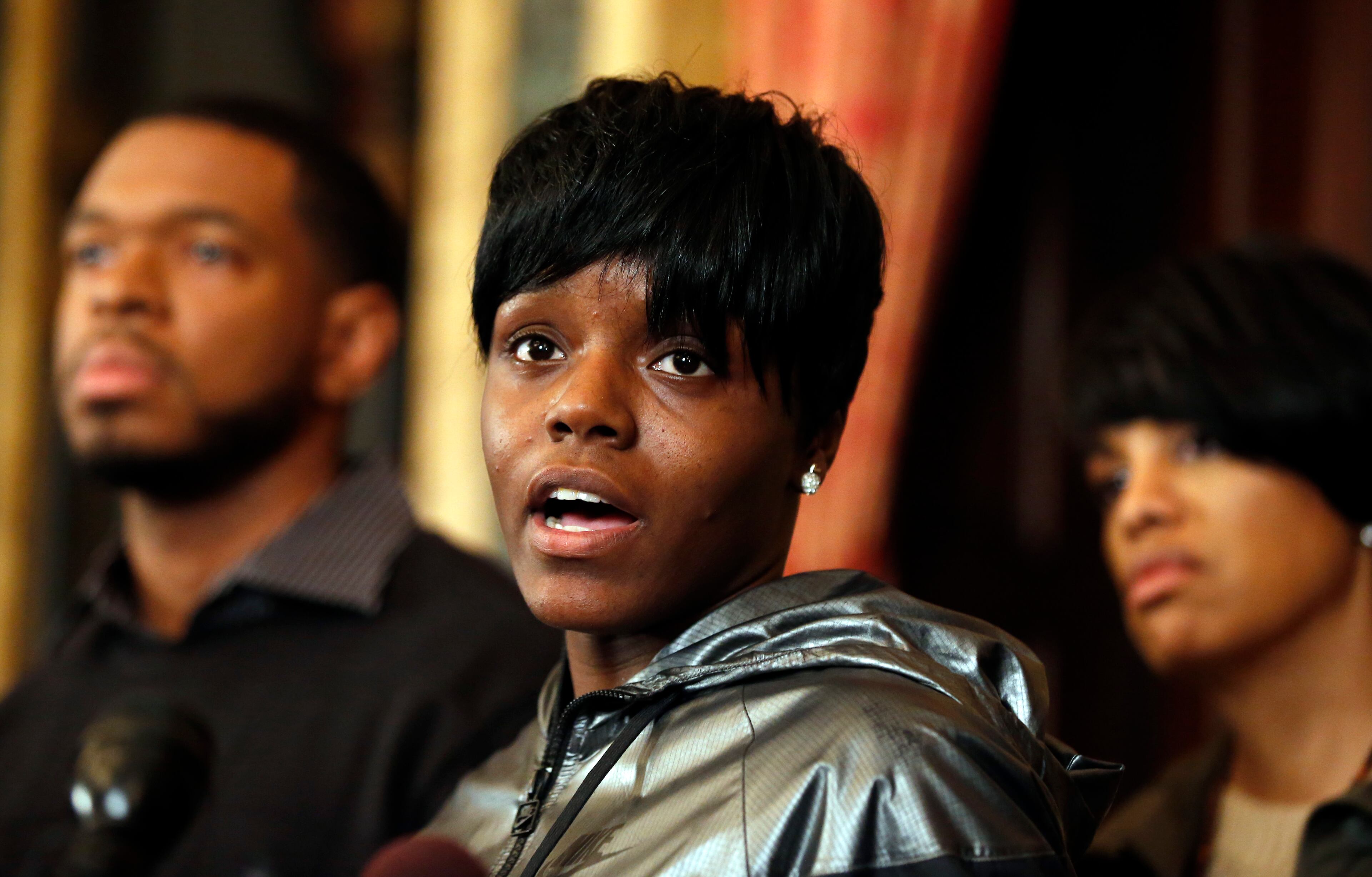 Fredricka Gray, center, the twin sister of Freddie Gray, speaks during a media availability at City Hall, after violence occurred after a march for Freddie Gray, Saturday, April 25, 2015 in Baltimore. Gray died from spinal injuries about a week after he was arrested and transported in a police van. (AP Photo/Alex Brandon)